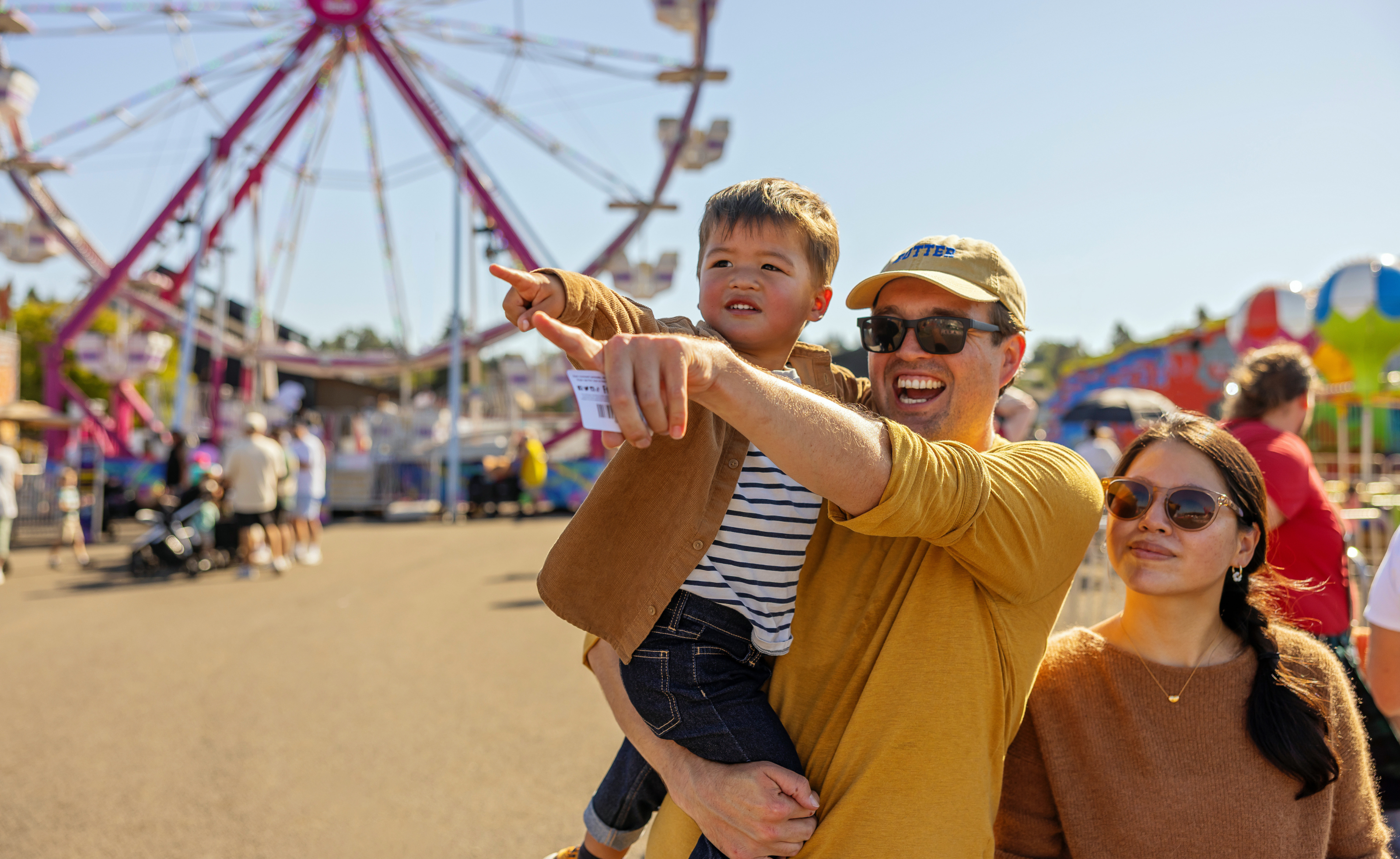 Families enjoying carnival rides at the Washington State Spring Fair in Puyallup