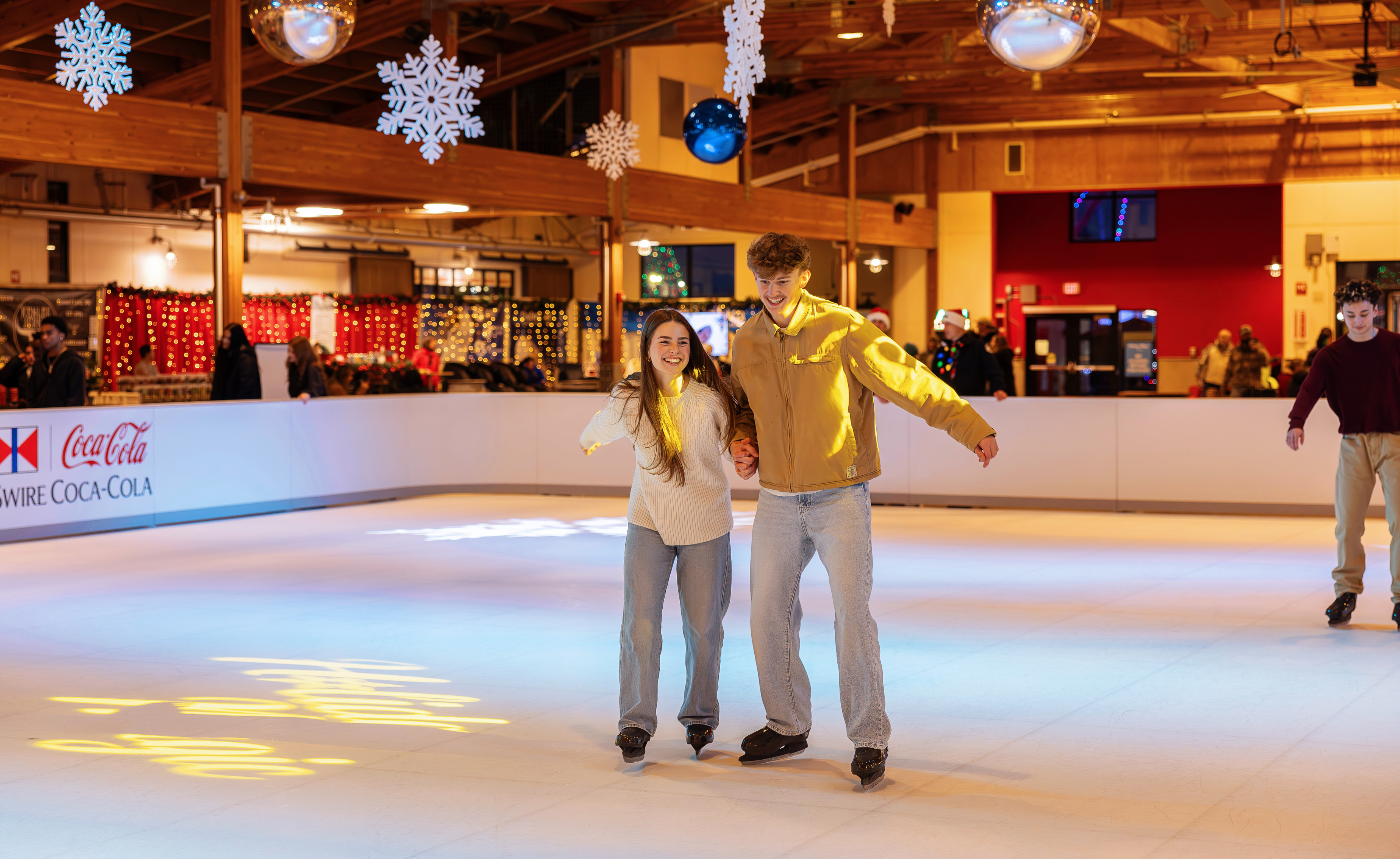 Couple Ice Skating at the Glice Rink at Holiday Magic