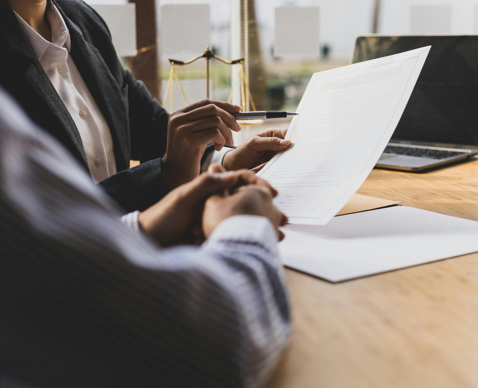 people looking at a paper