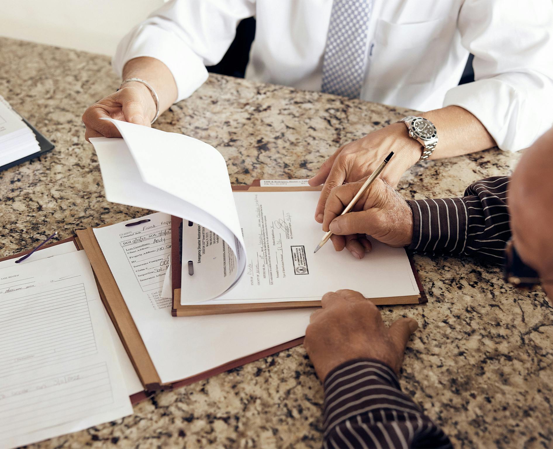 people working on paperwork