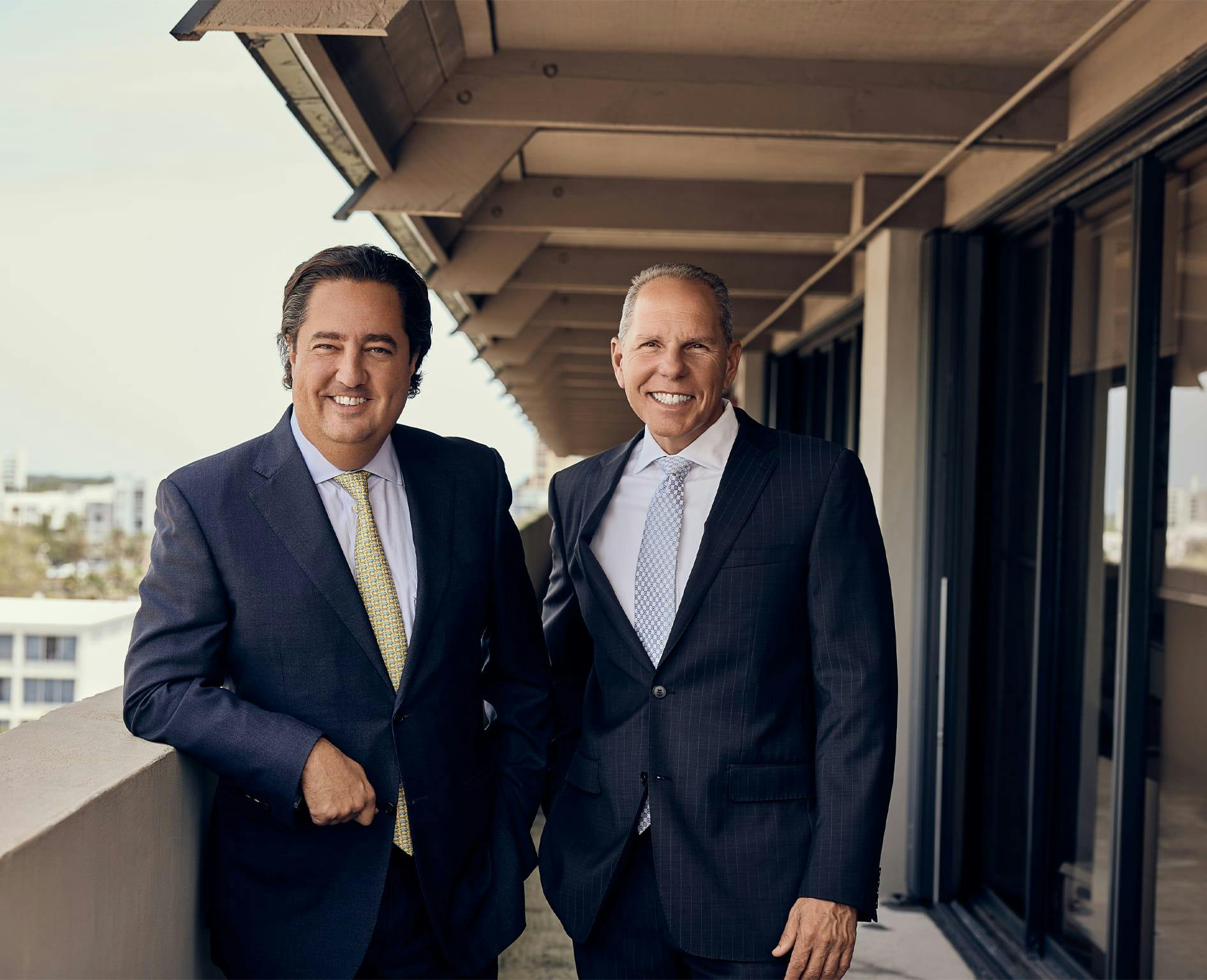 Two attorneys standing on a balcony