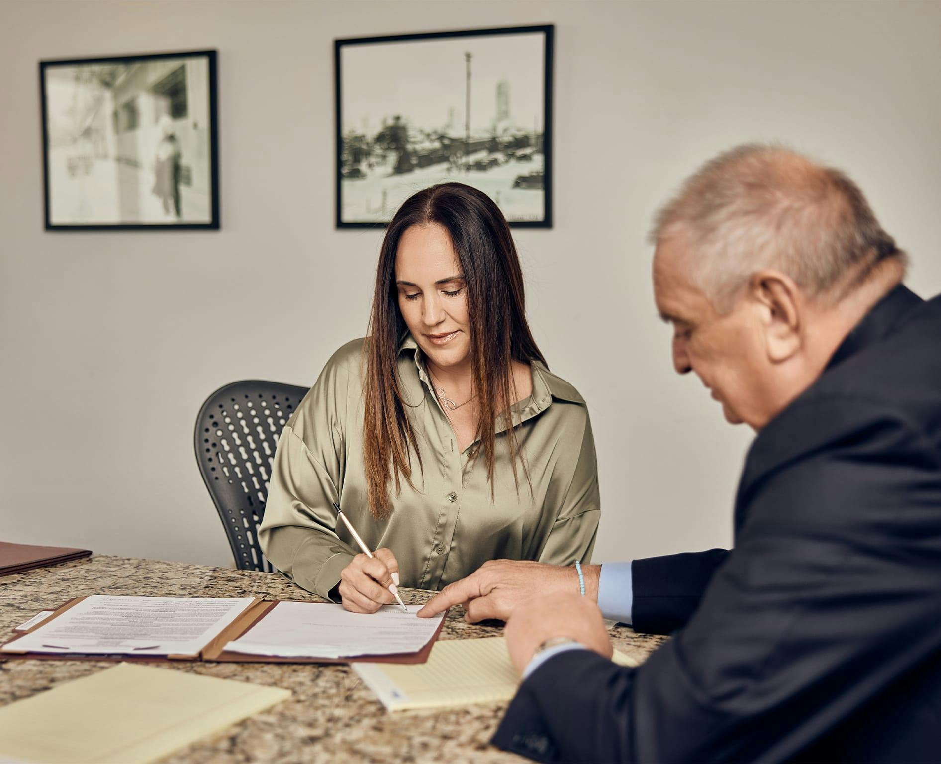 Woman signing paper
