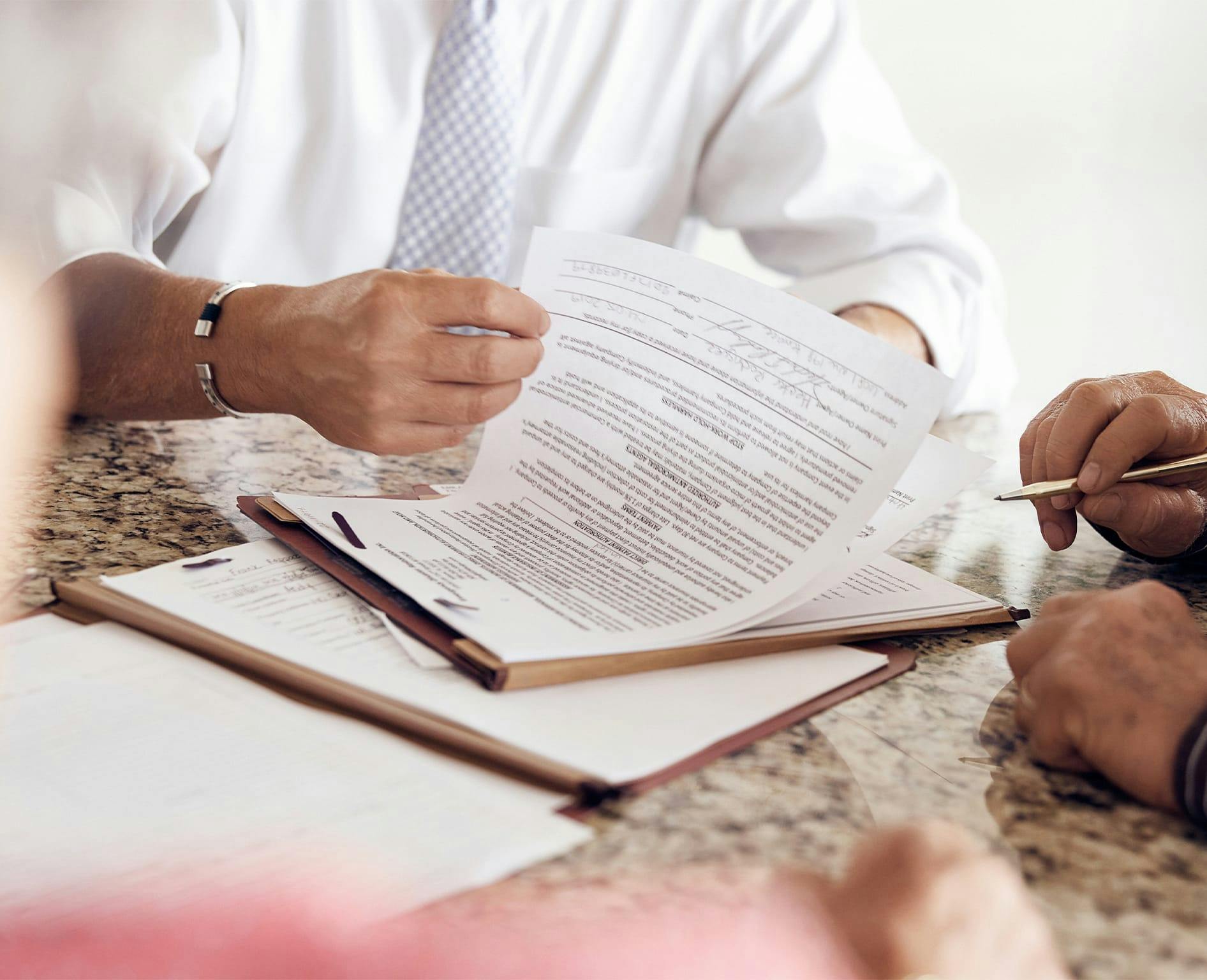 Contract being flipped through