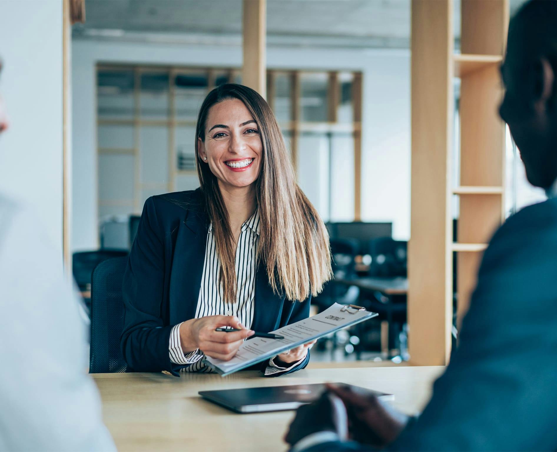 woman pointing to clipboard