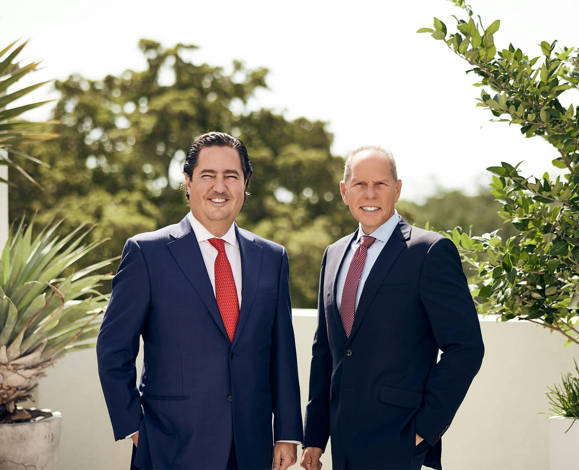 Correa & Martinez standing outside
