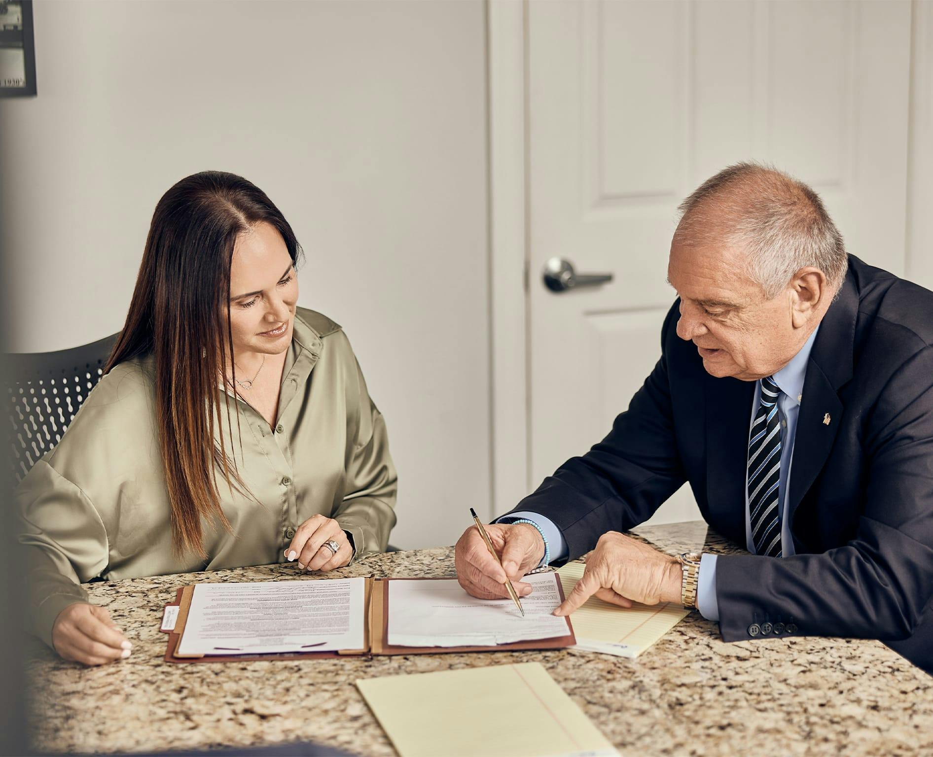 Attorney Robert Pardo speaking with a client