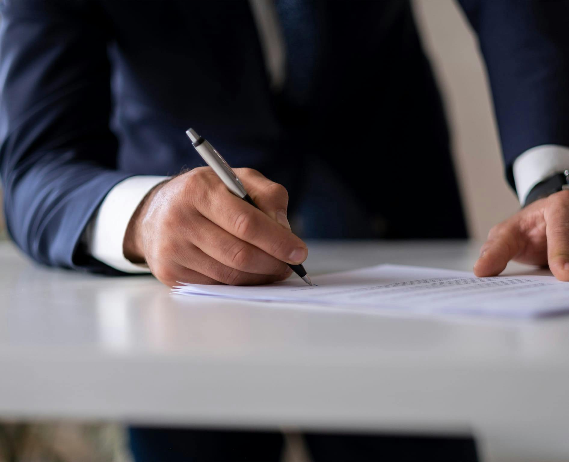 person writing on paper