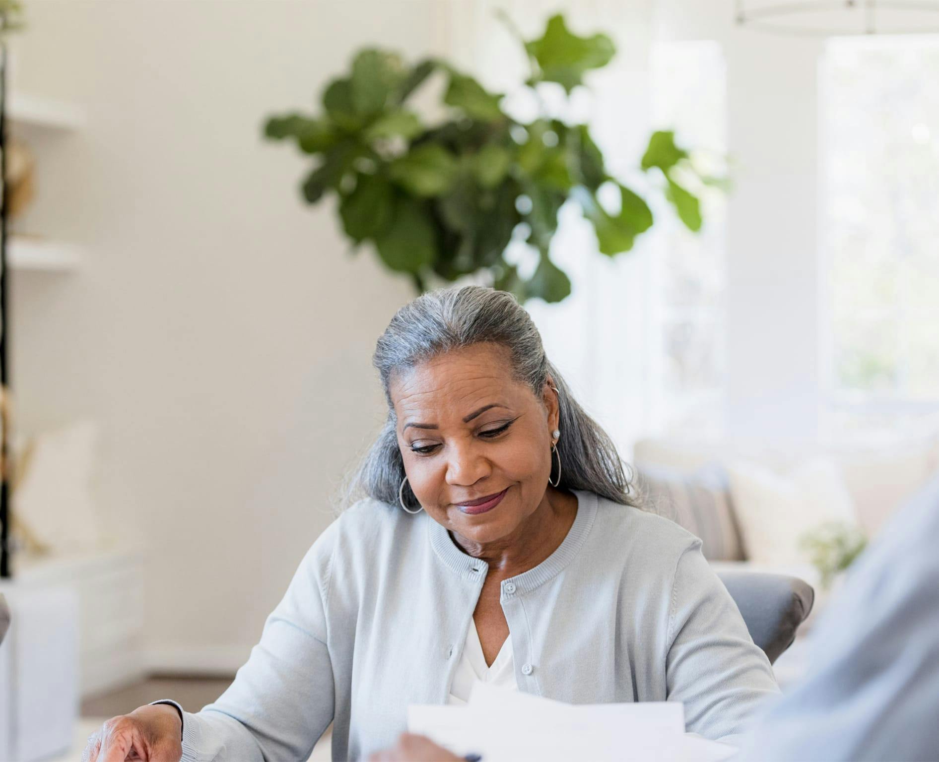 Woman looking down at papers
