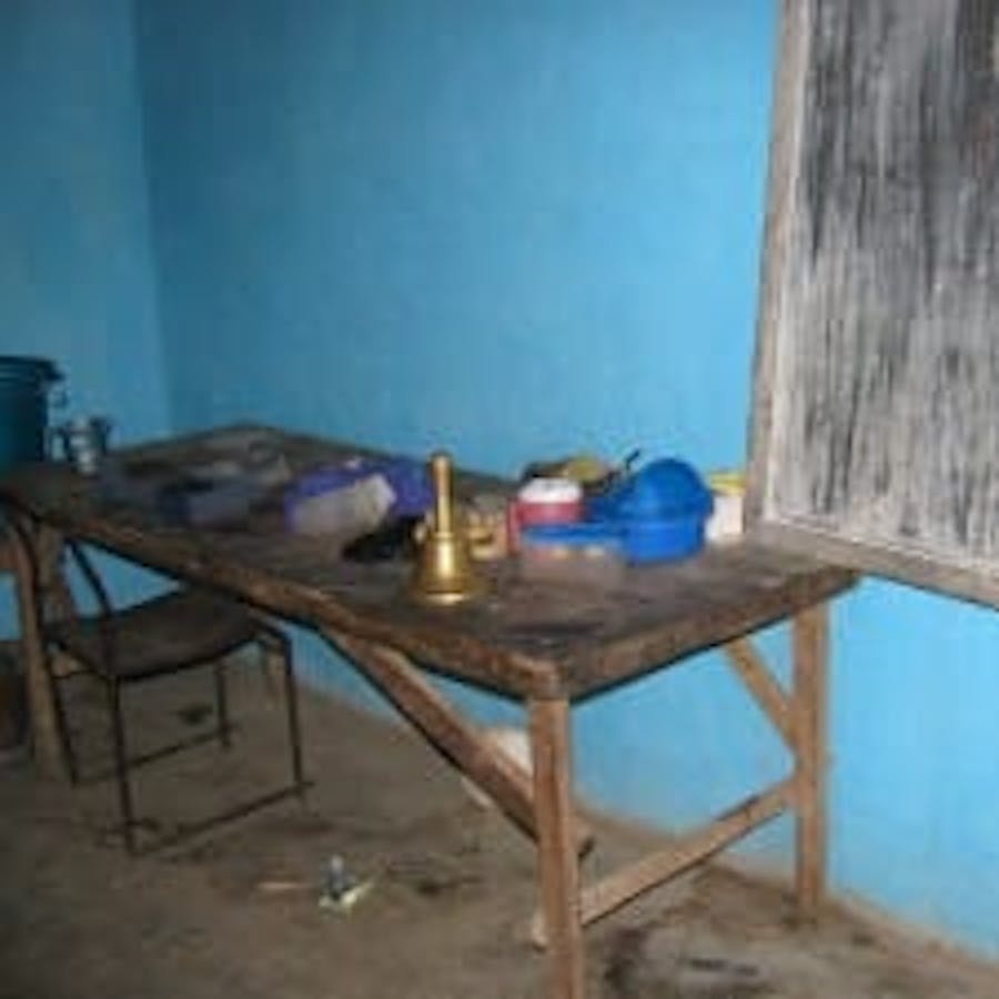 table with sparse school supplies