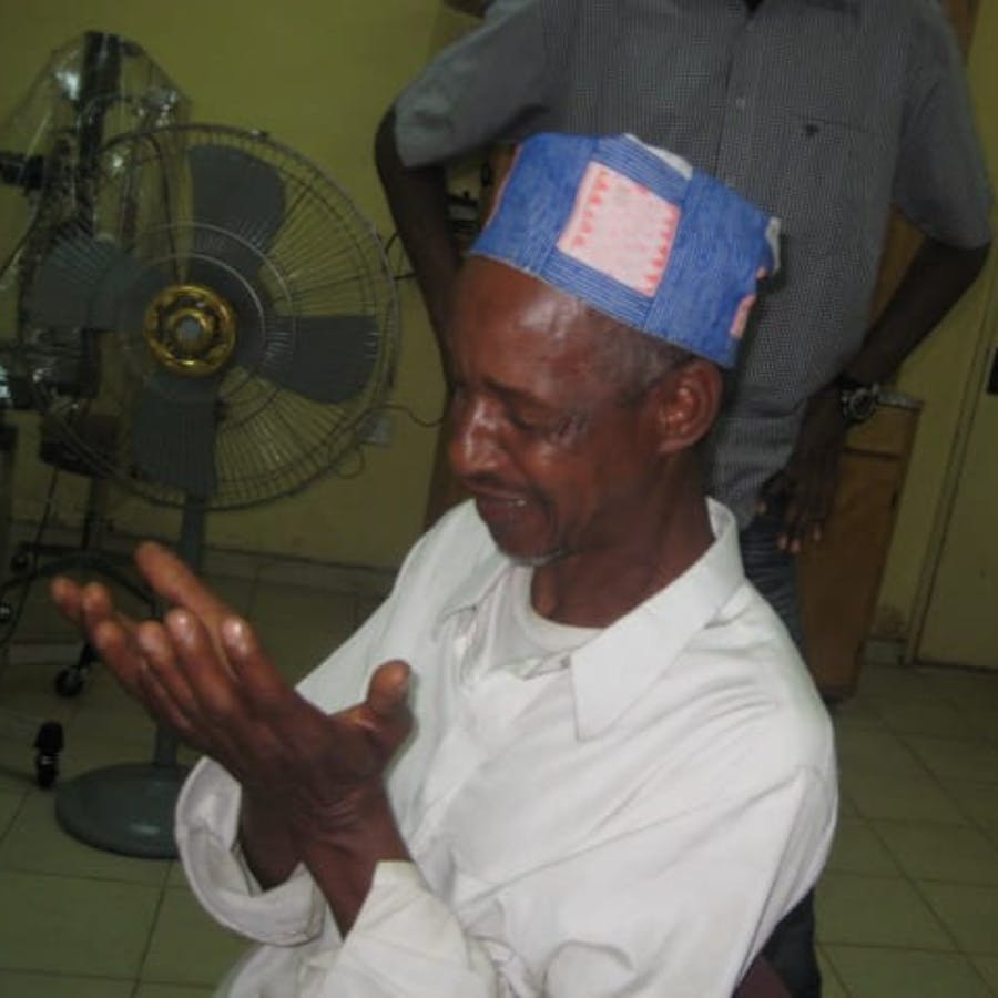 man looking at hands