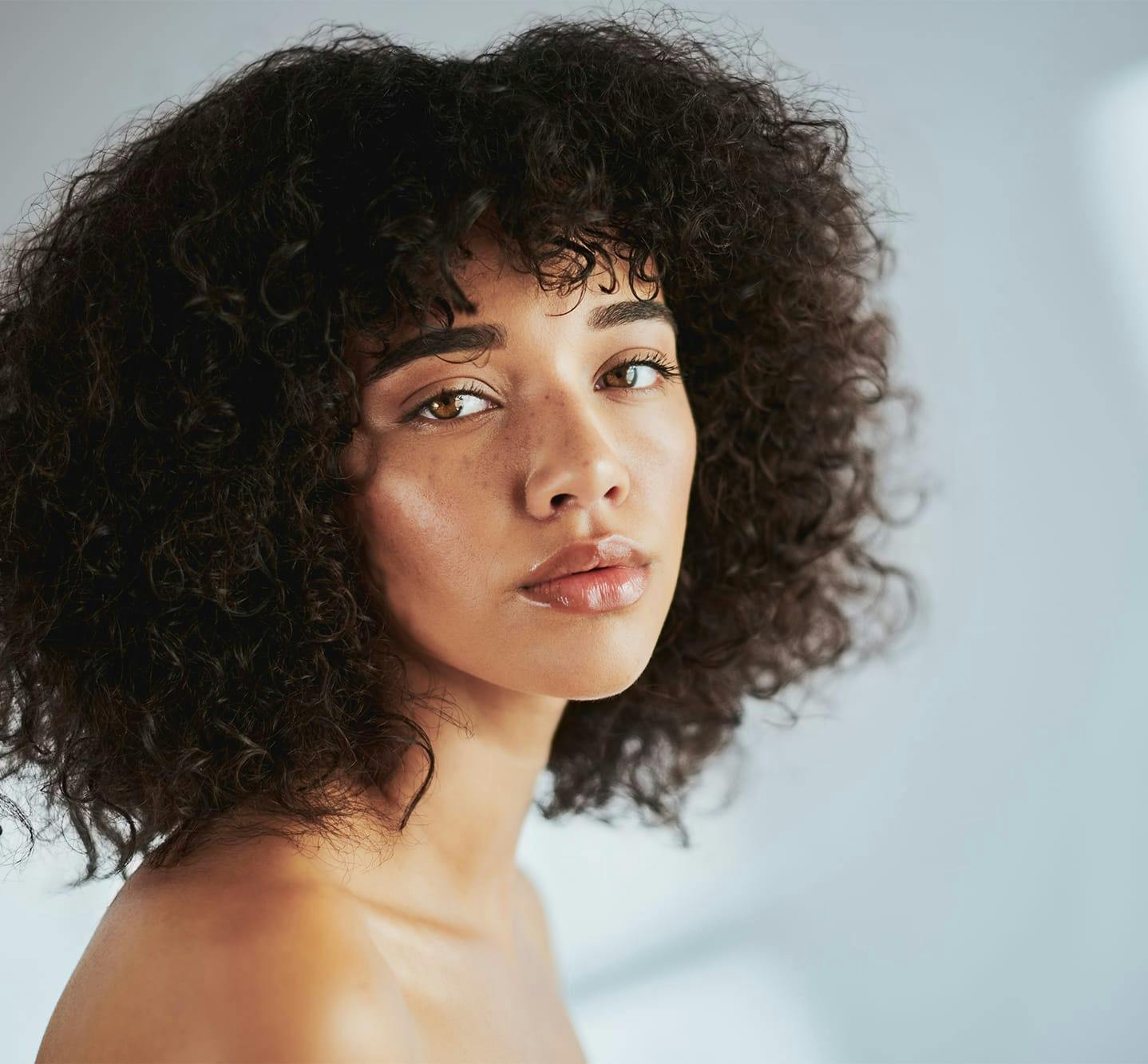 woman looking over her shoulder
