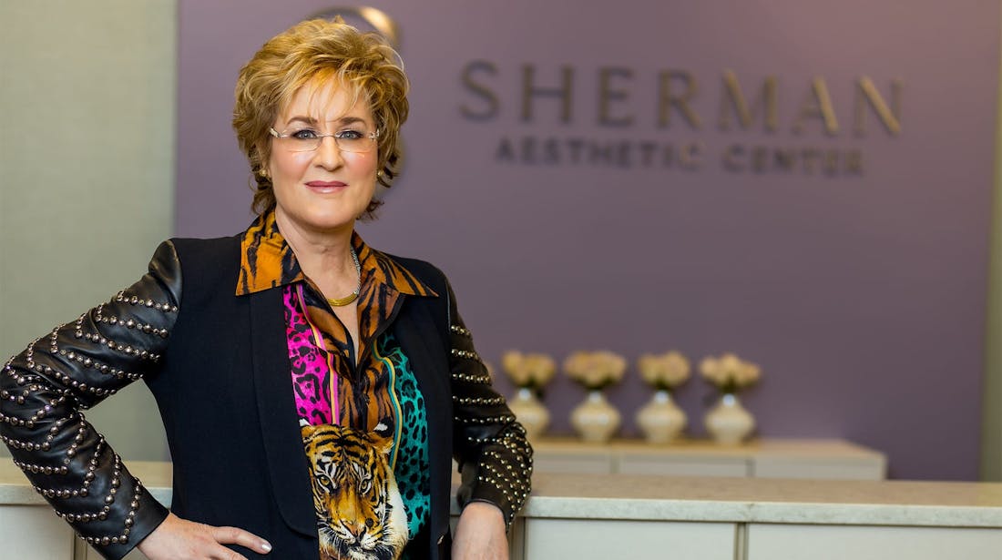 Dr Sherman at reception counter