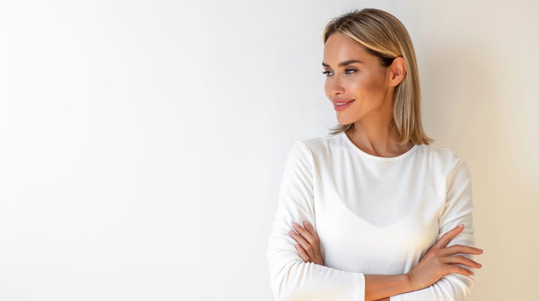 woman smiling and looking to the side