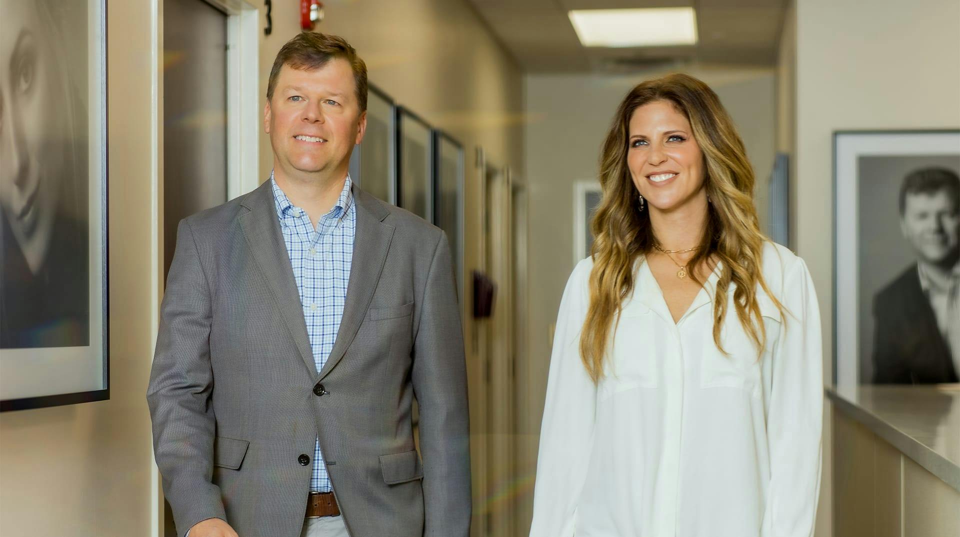 Dr Melson and Dana walking down the hallway