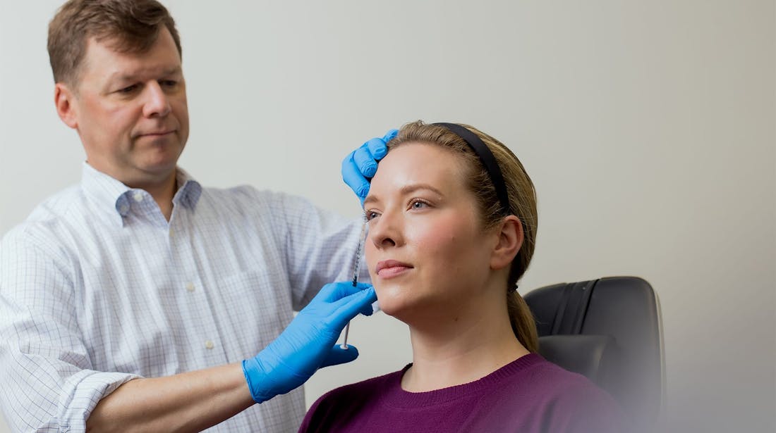 patient receiving facial injection