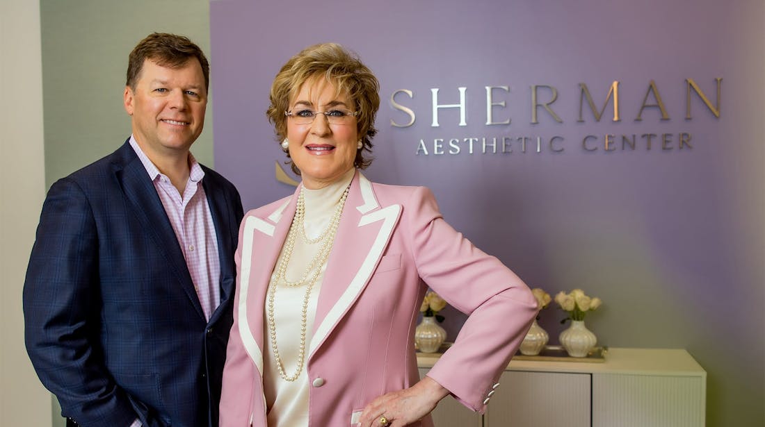 Dr Sherman and Melson in reception area