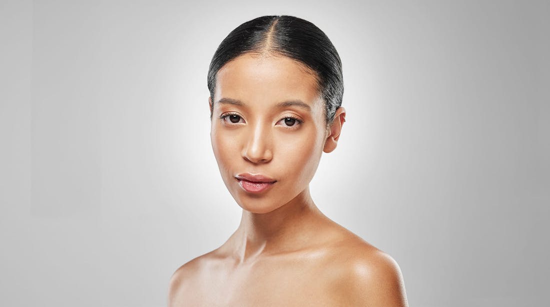 woman in front of grey background