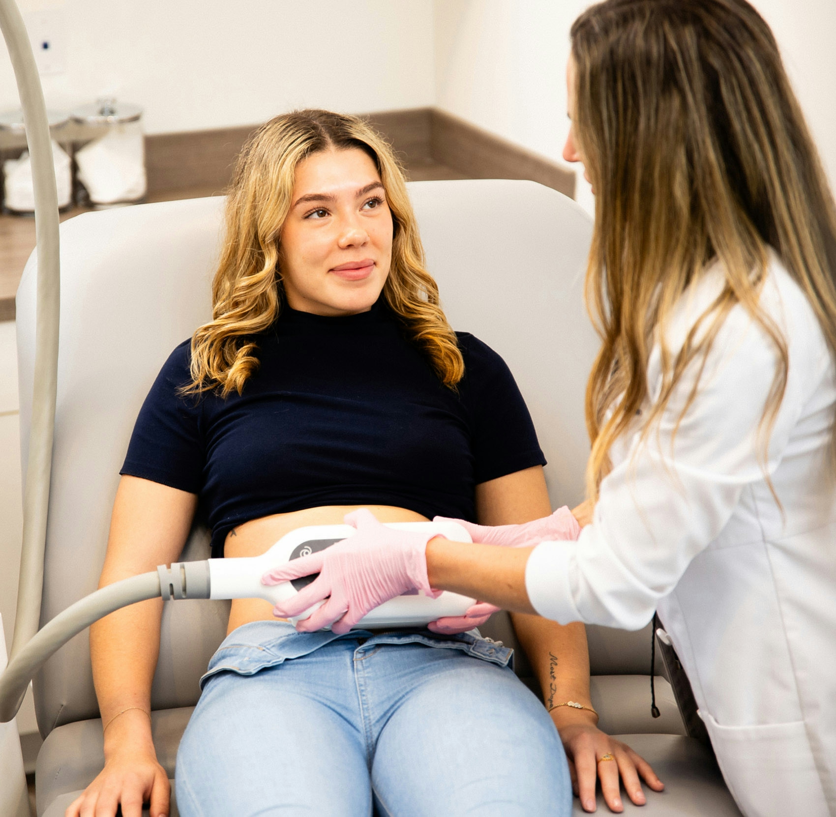 Woman getting stomach treatment