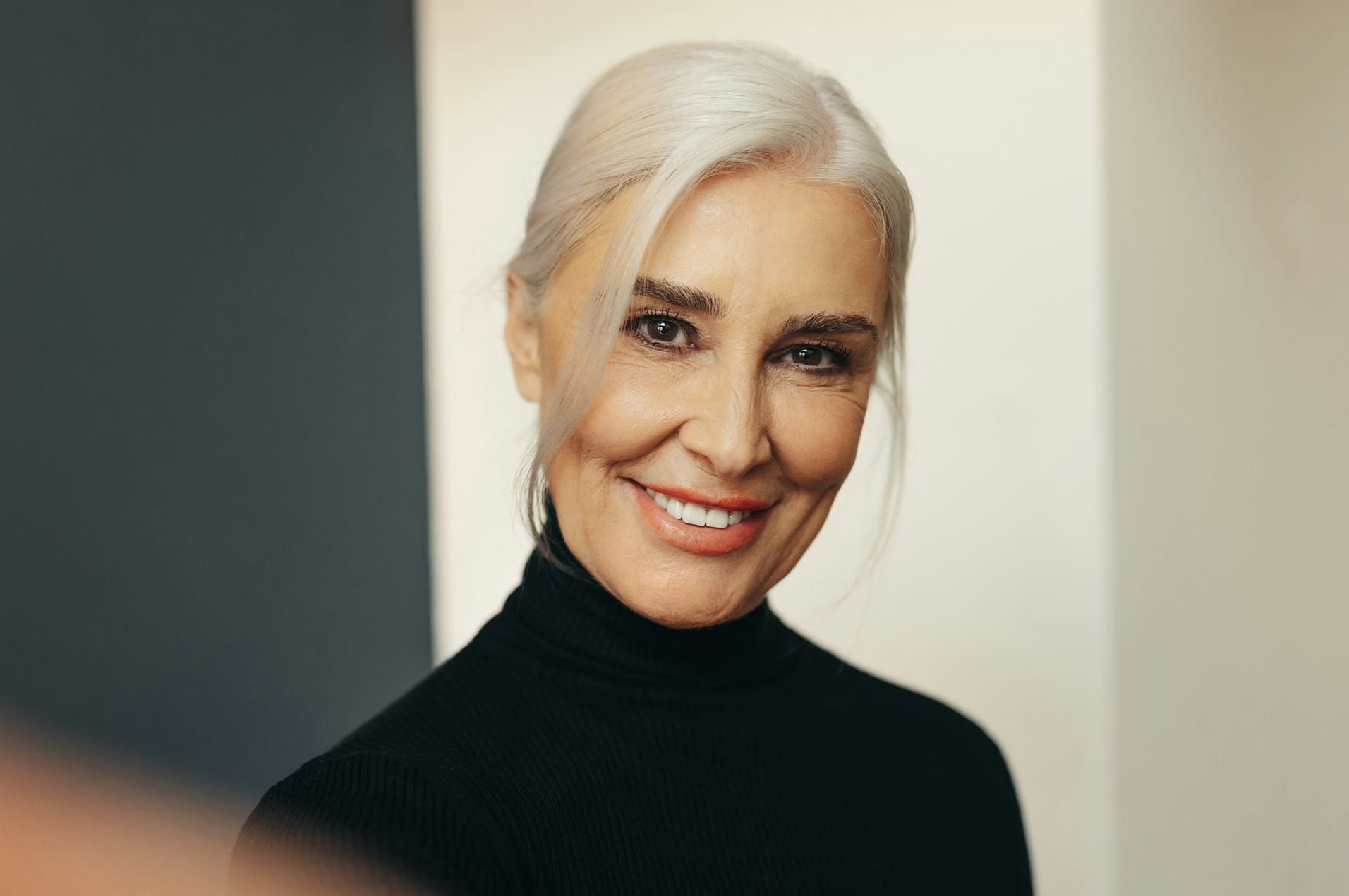 Older woman smiling into camera