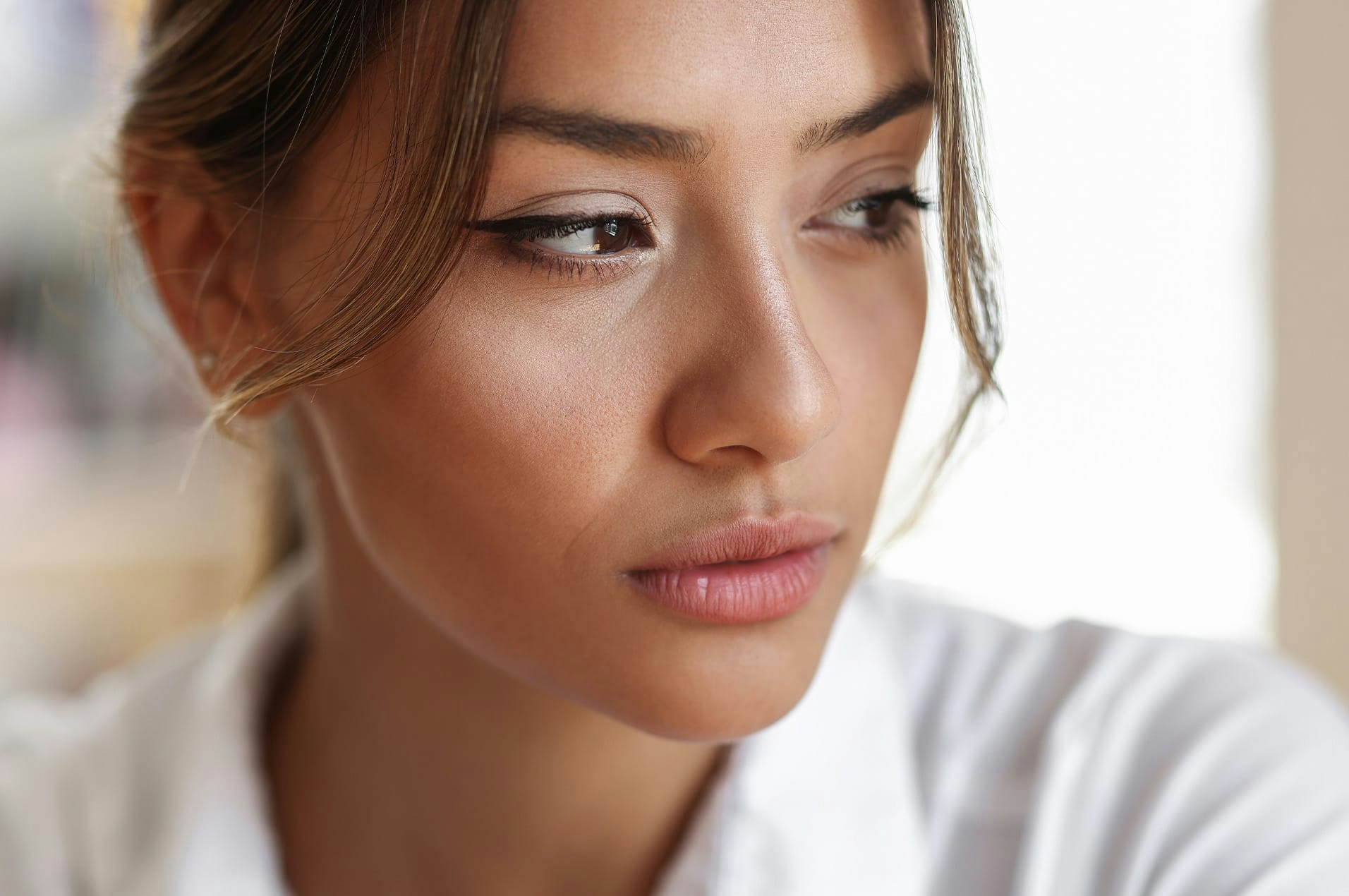 Woman looking off camera sad