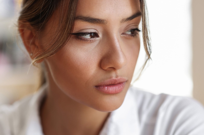 Woman looking off camera sad