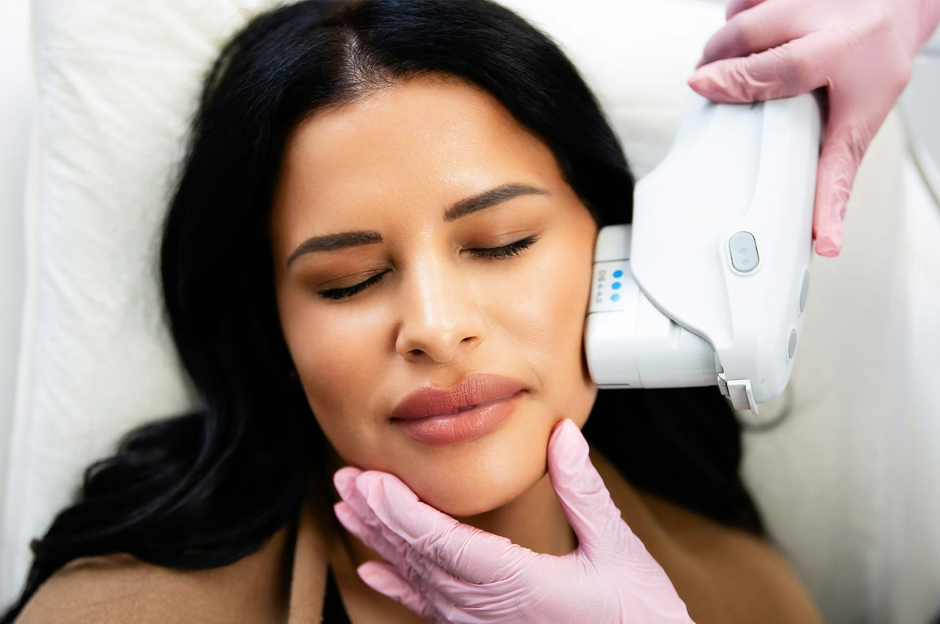 Woman getting face treatment