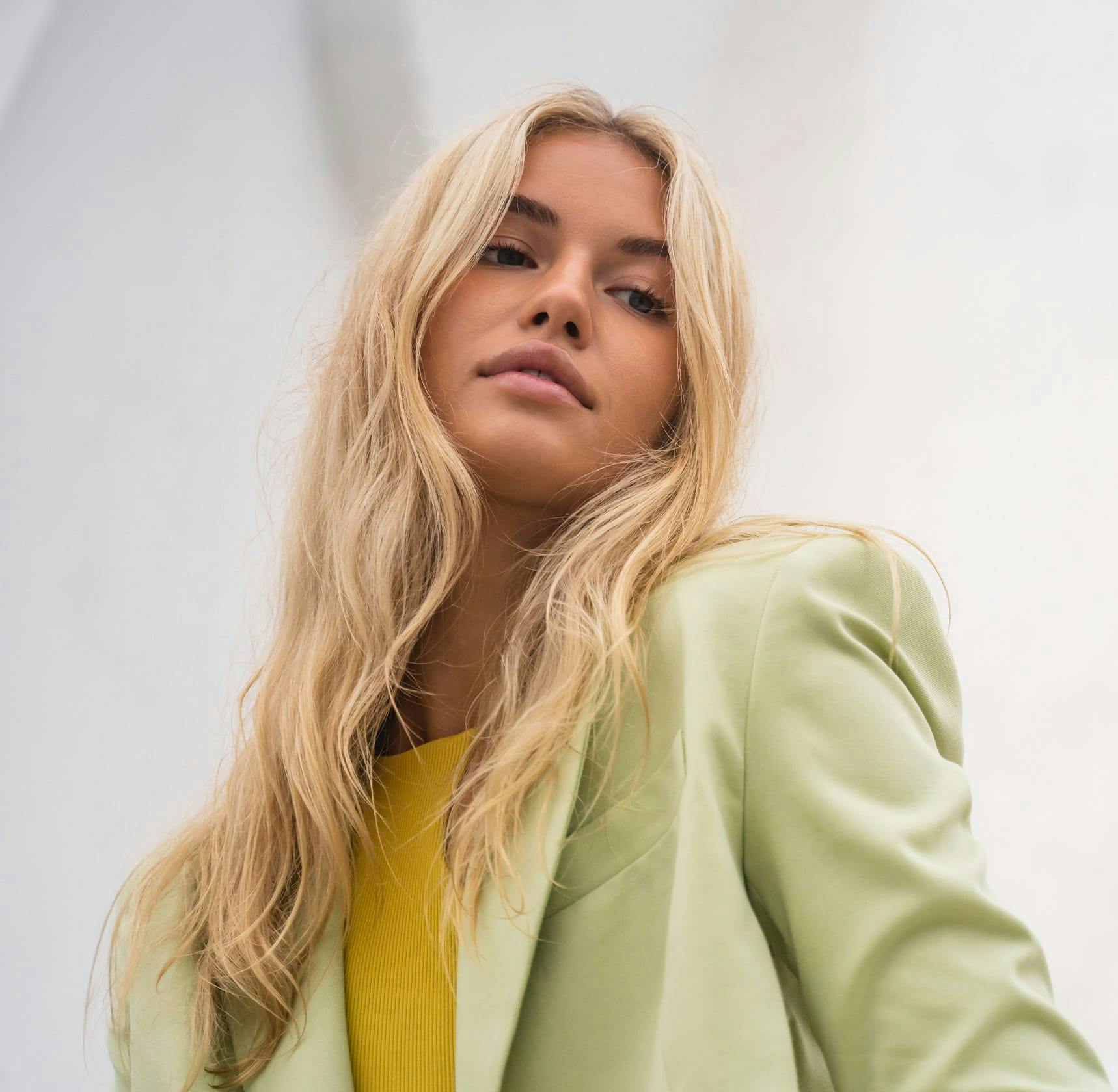 Woman looking down at camera