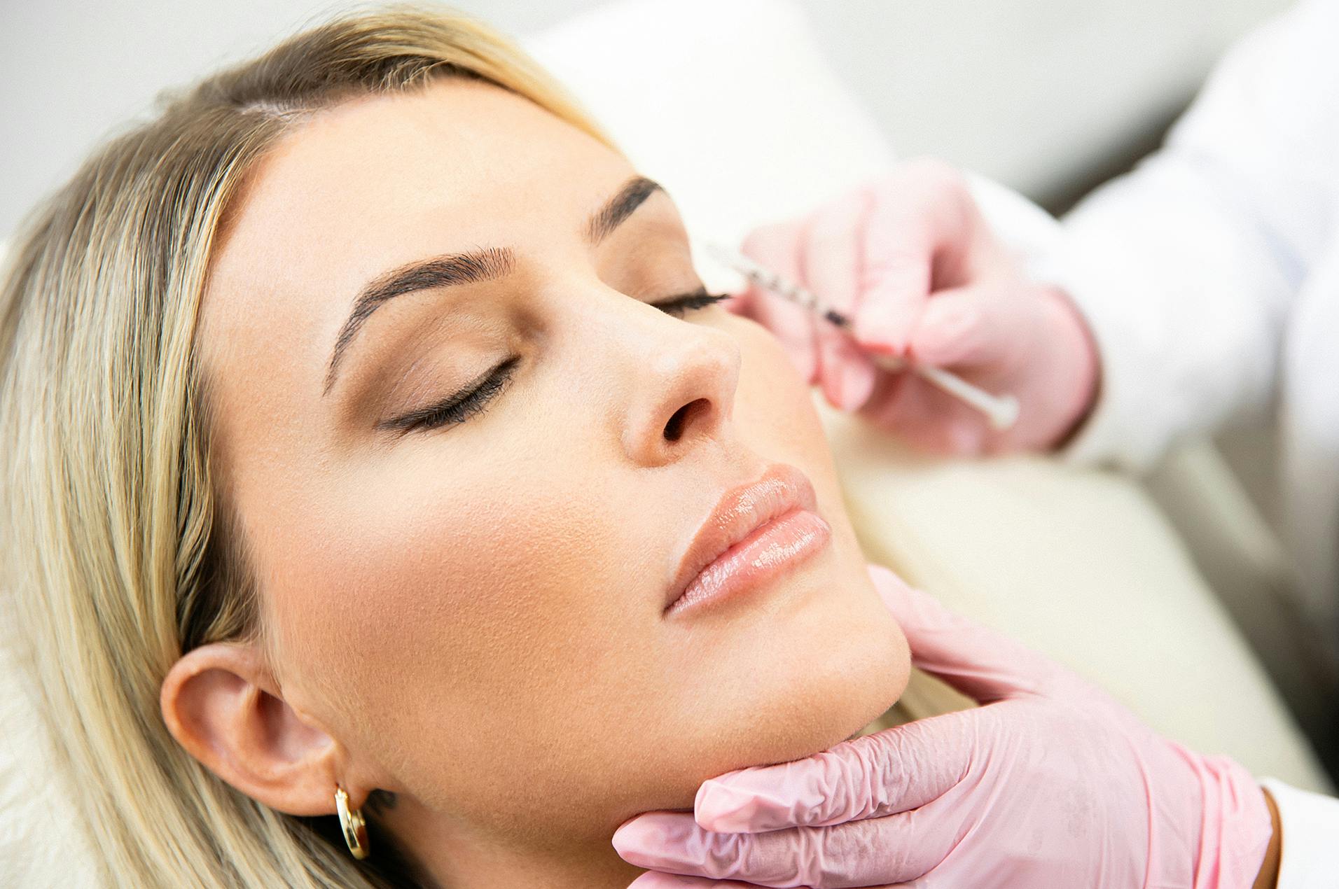 Woman recieving facial treatment