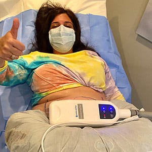 patient giving thumbs up after CoolSculpting