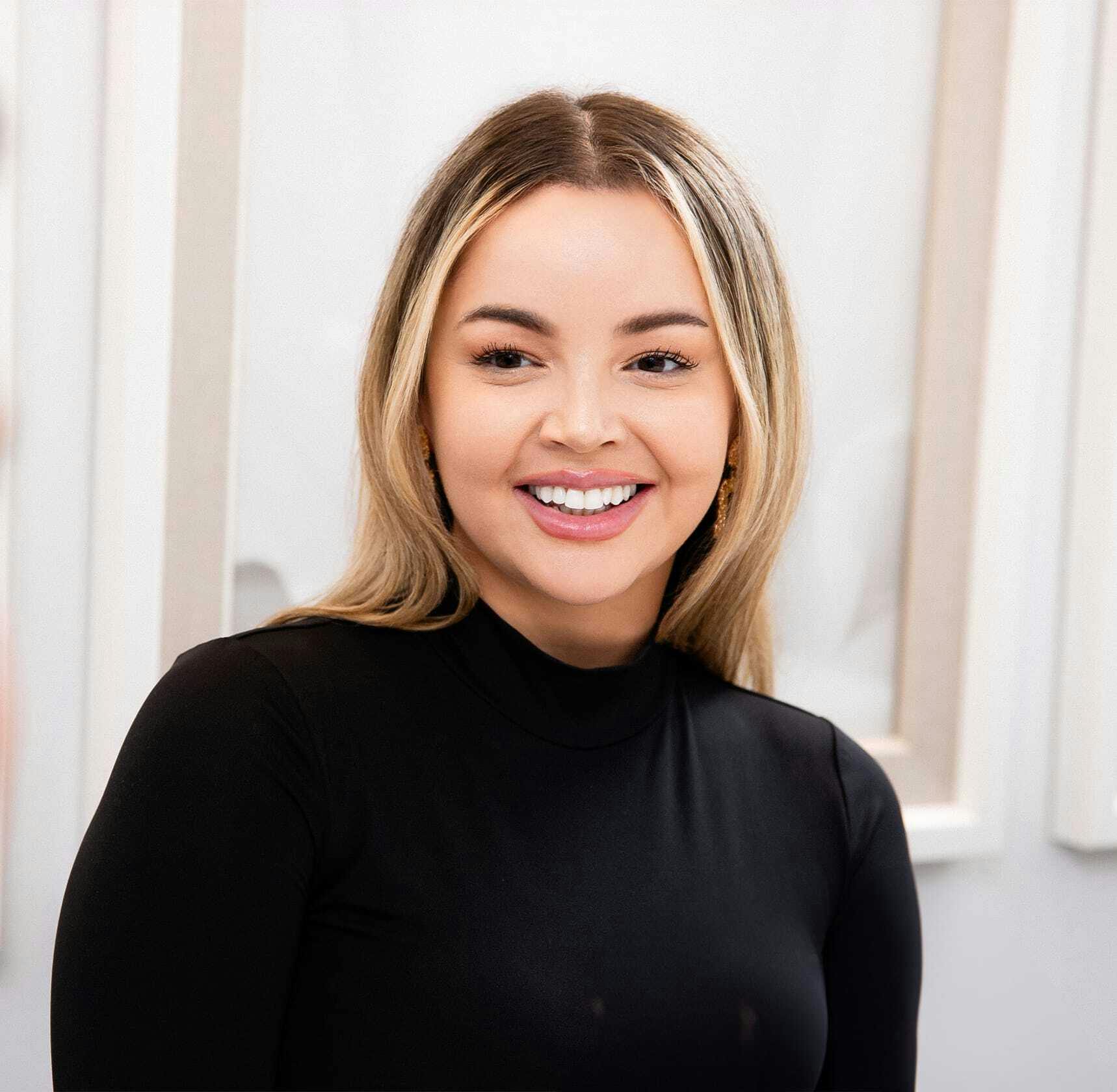Smiling woman in black shirt