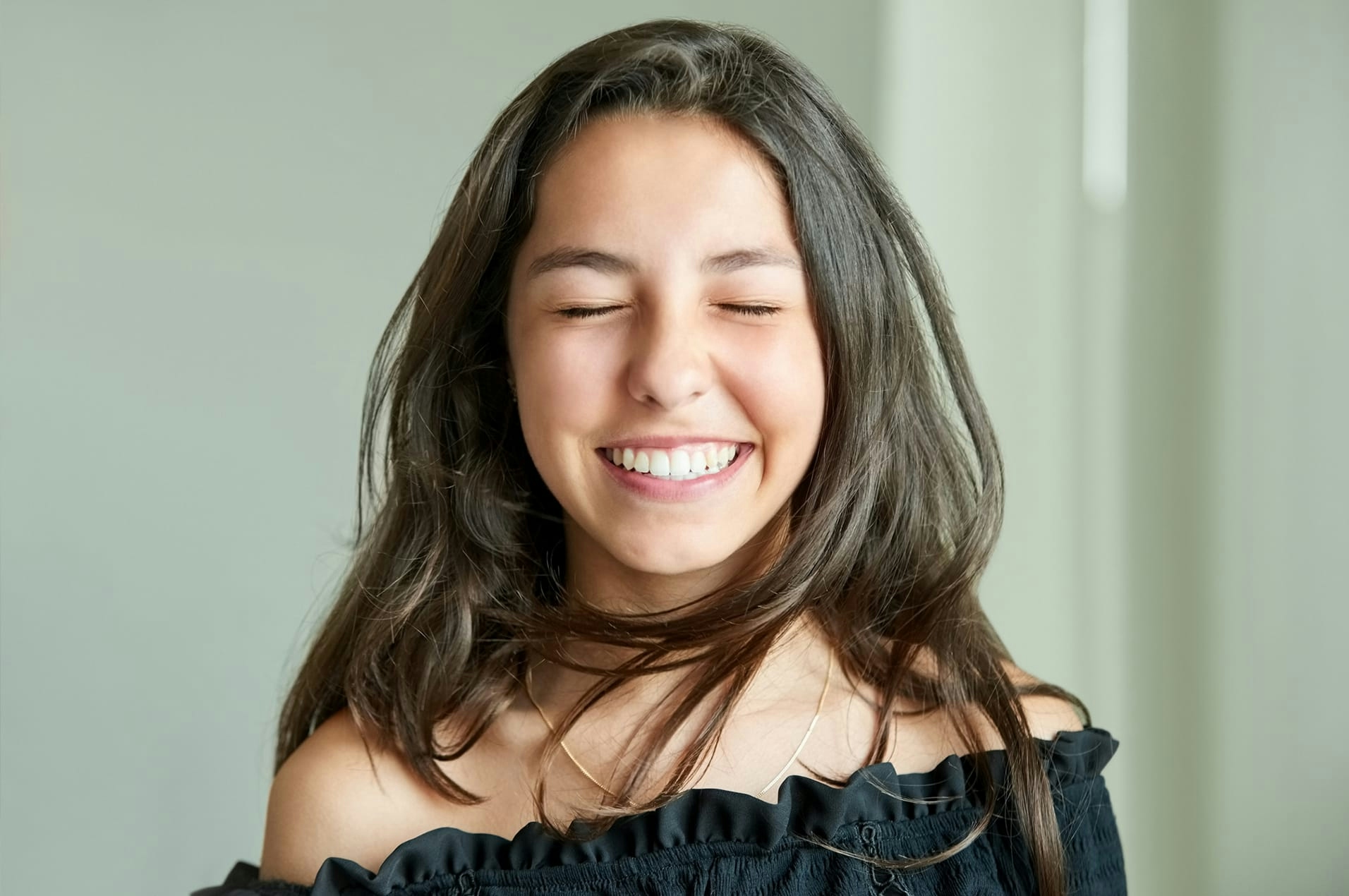 brunette teen smiling