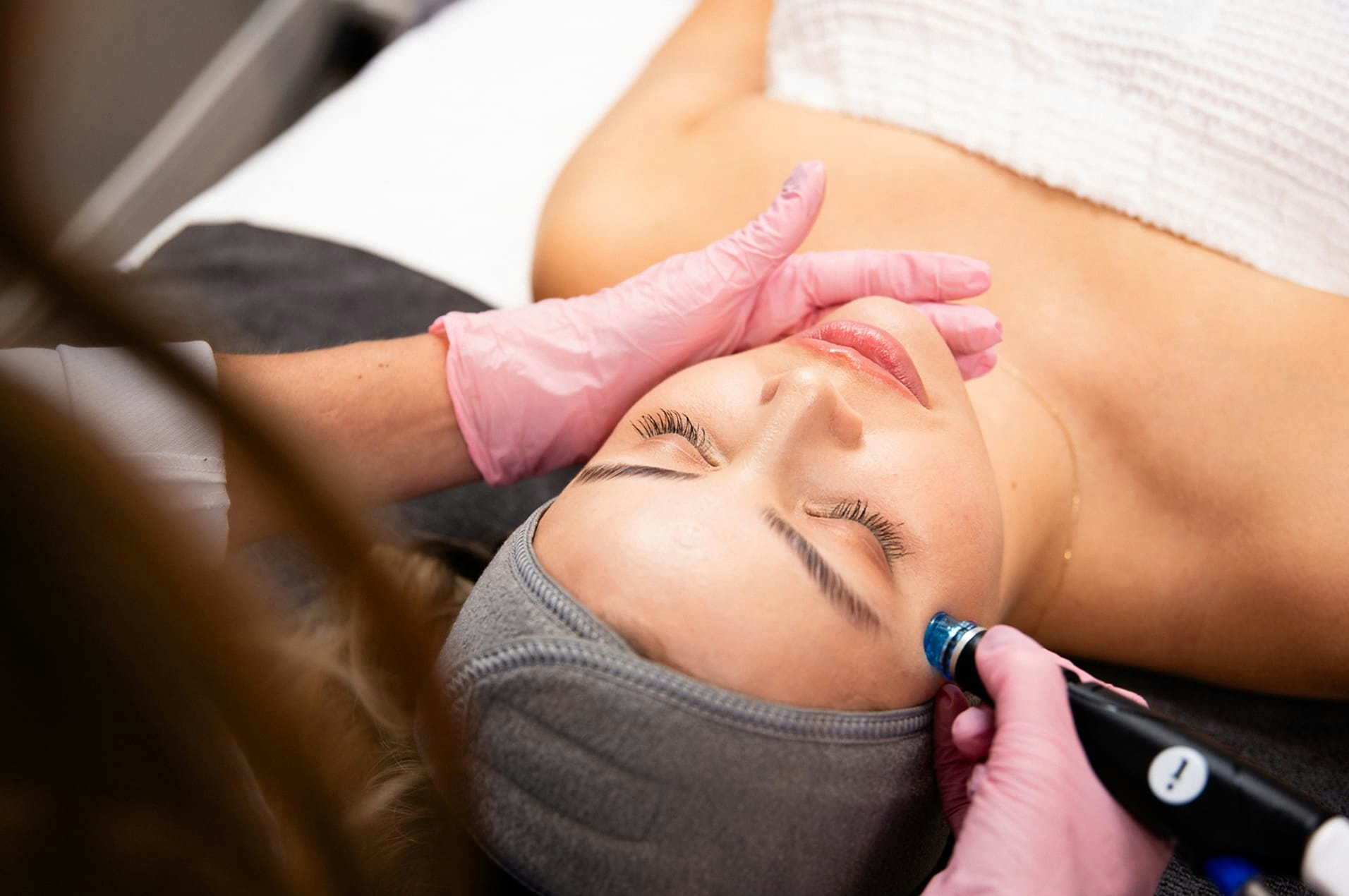 Woman getting face treatment