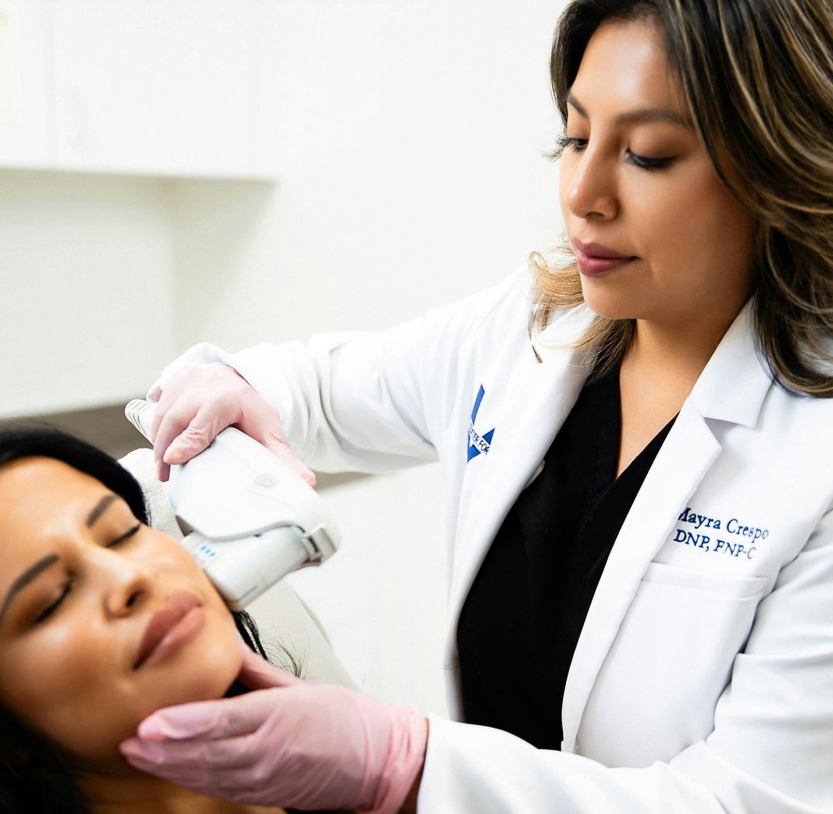 Nurse administering facial procedure