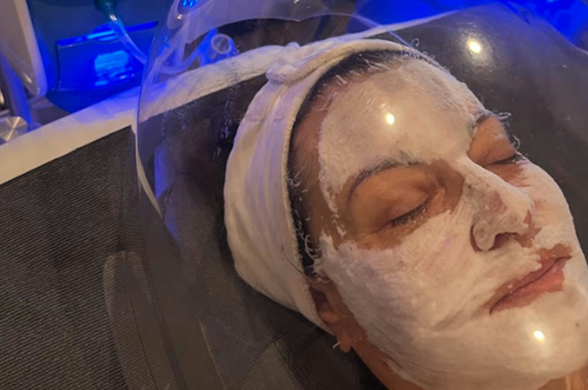 Woman receiving facial treatment