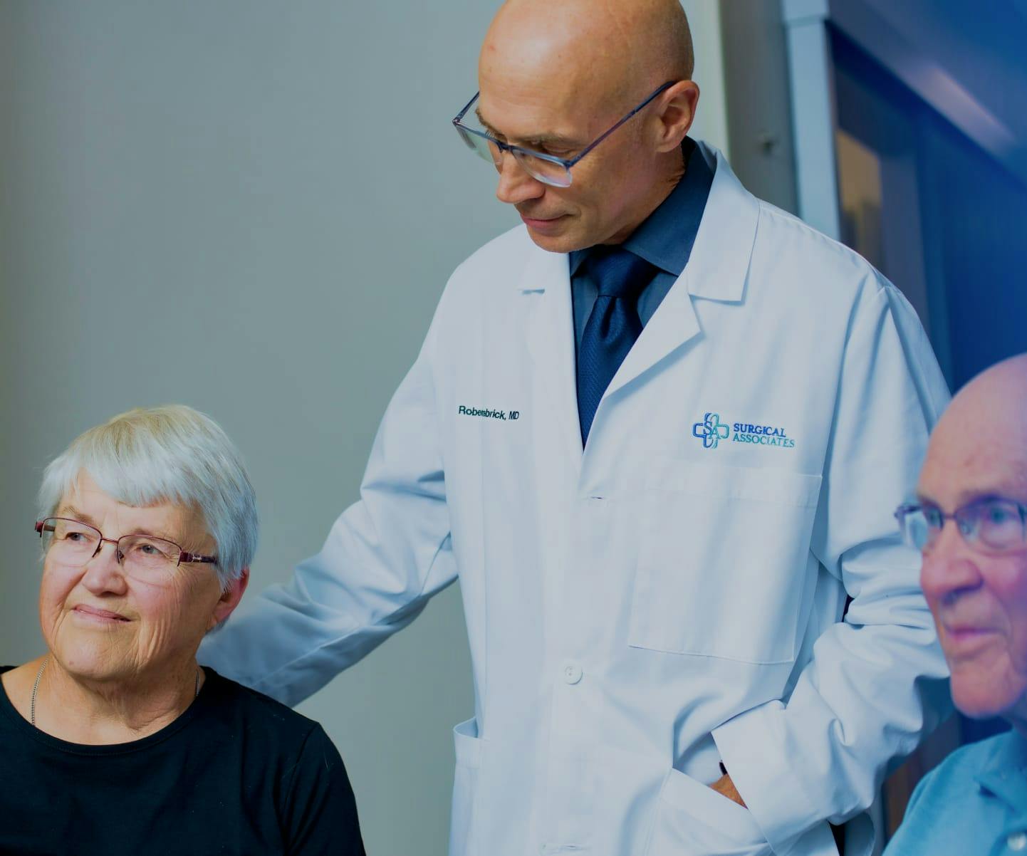 Doctor seeing a couple of patients