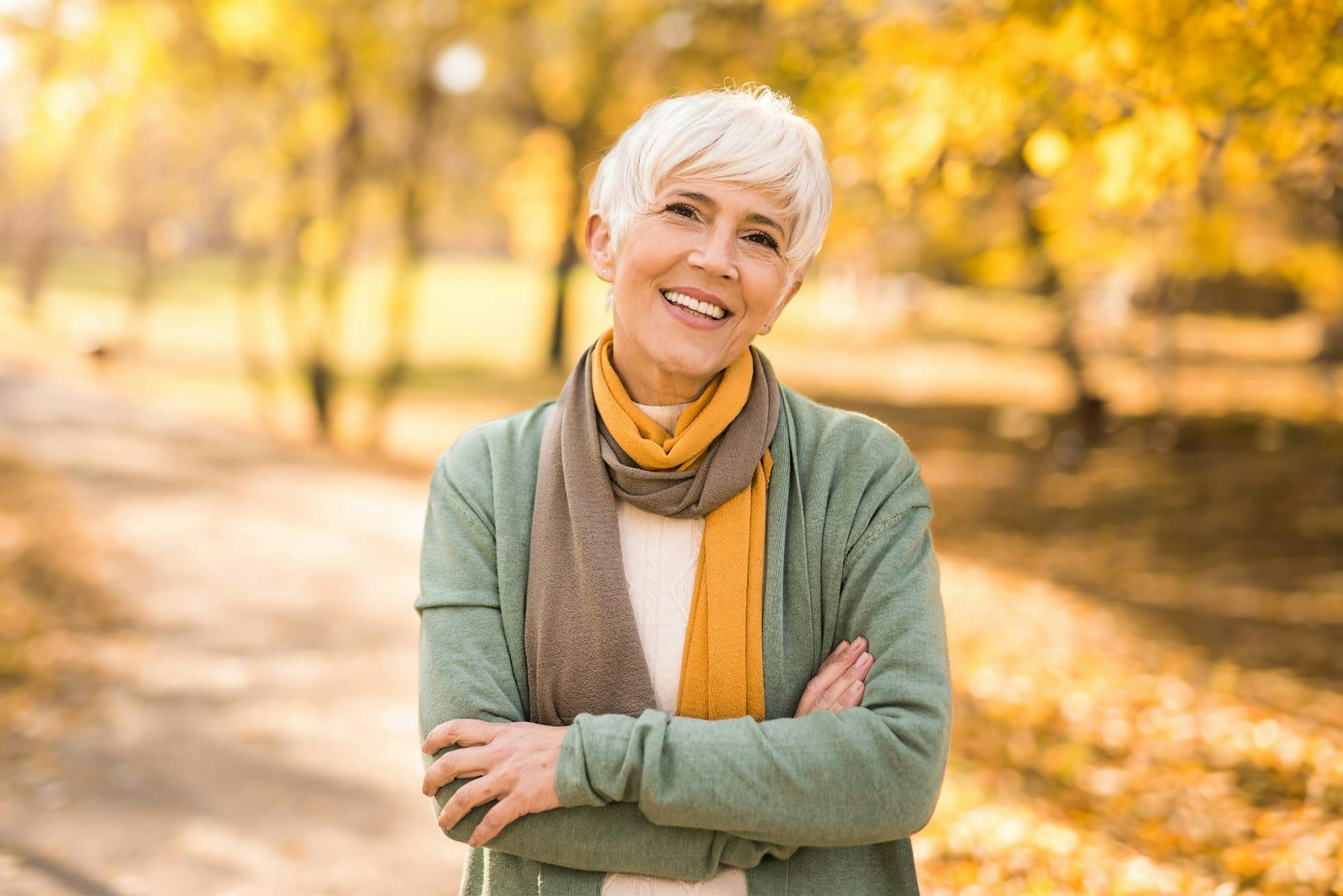 woman smiling on park trail
