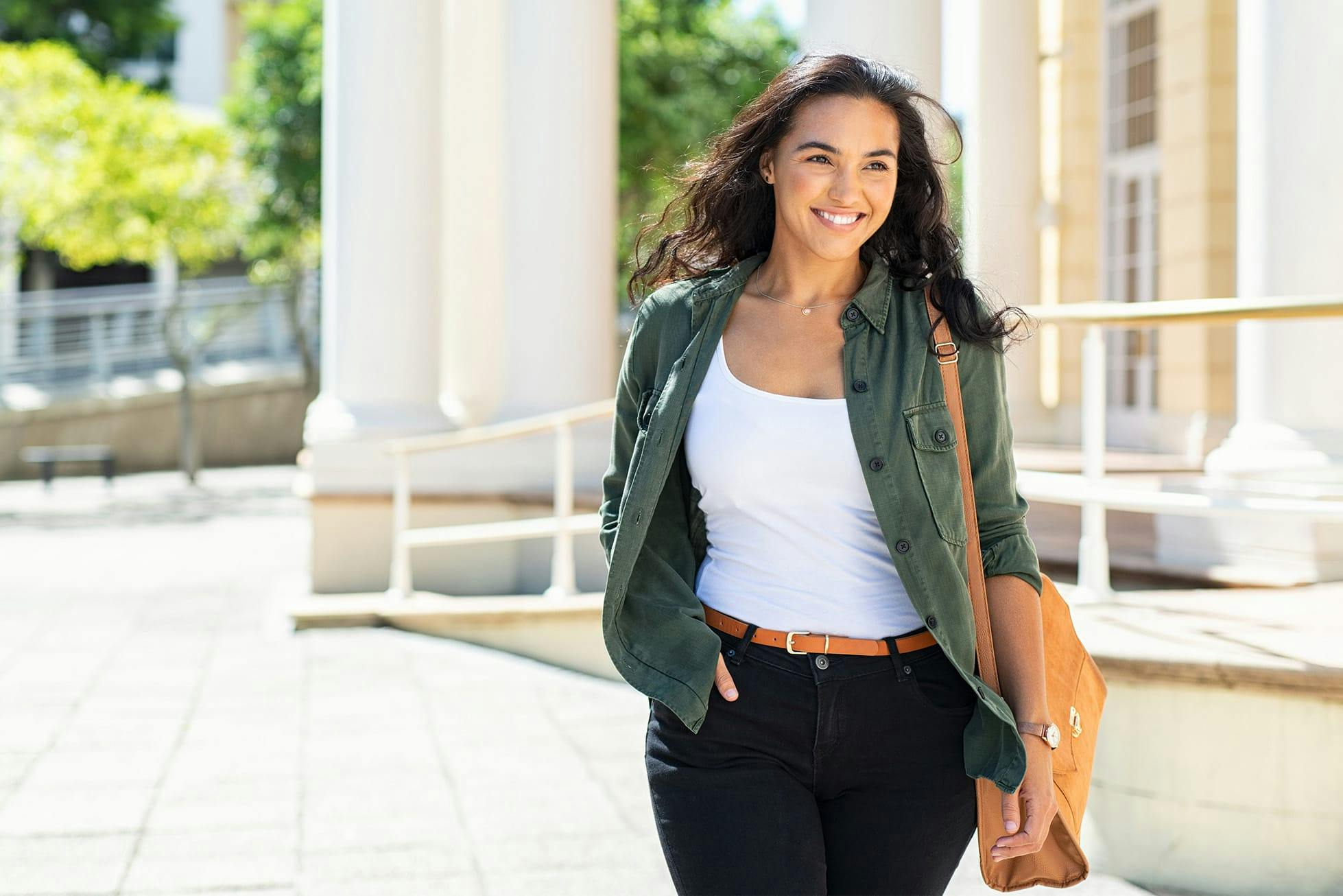 woman smiling near building