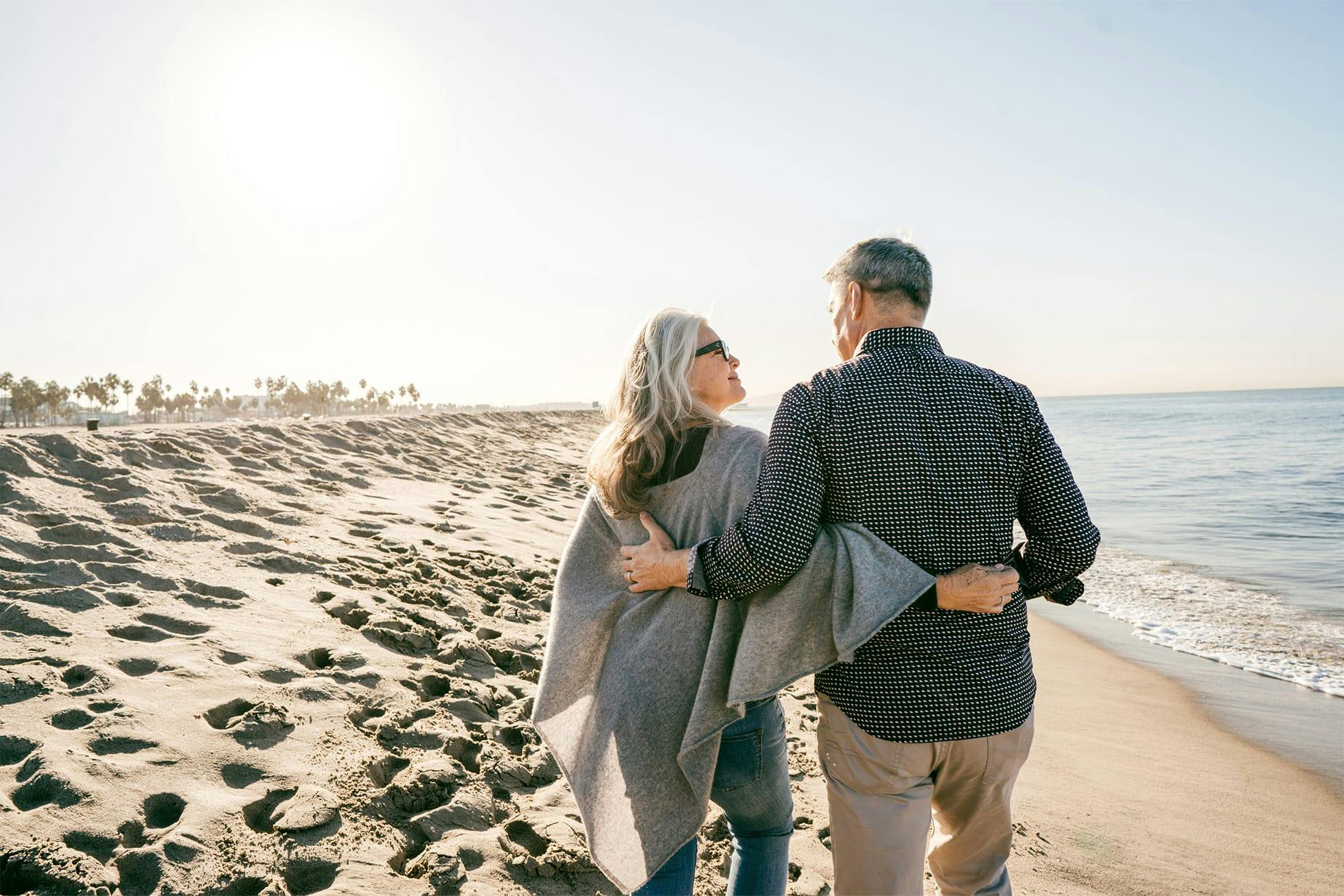 couple walking down beach