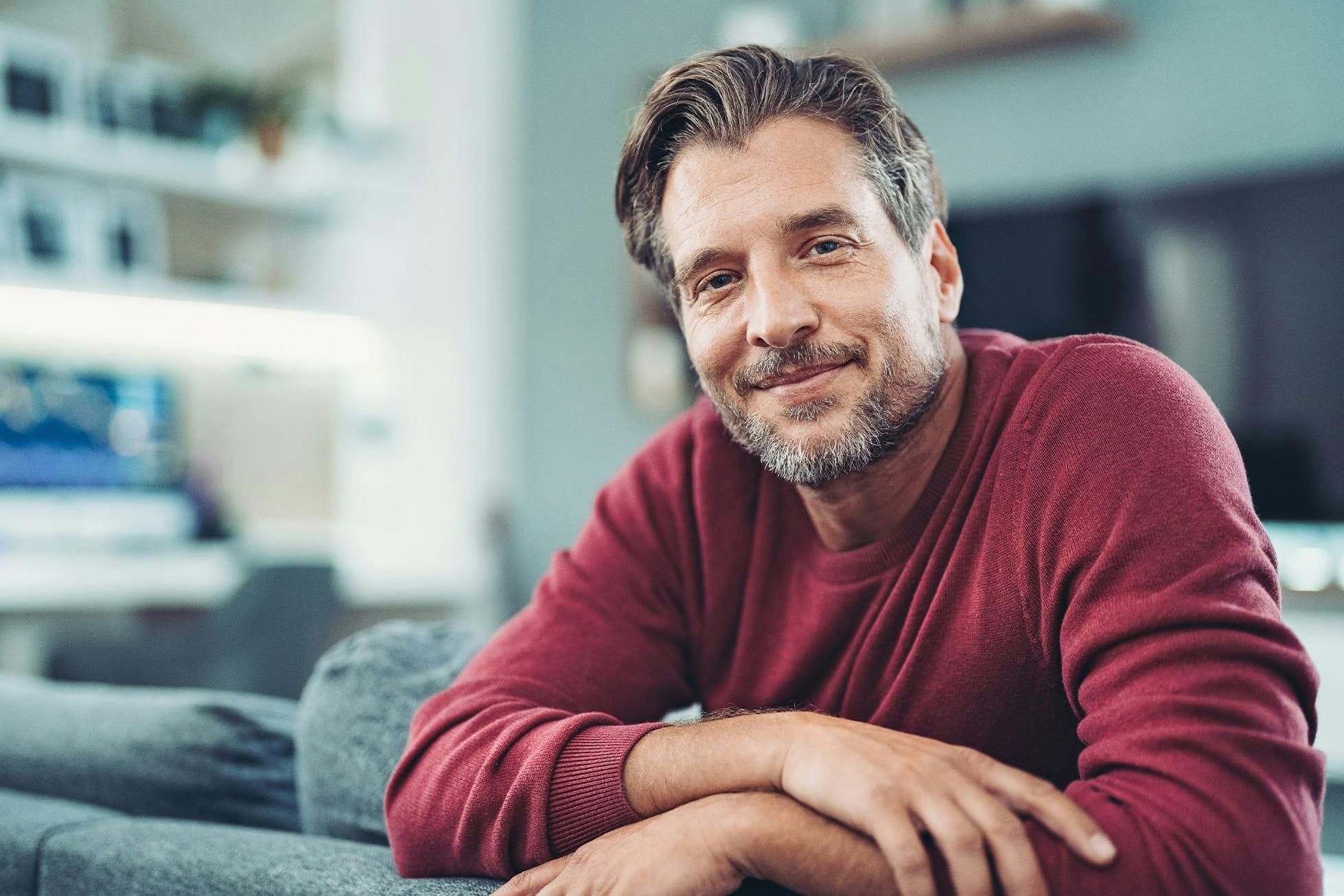man sitting on couch