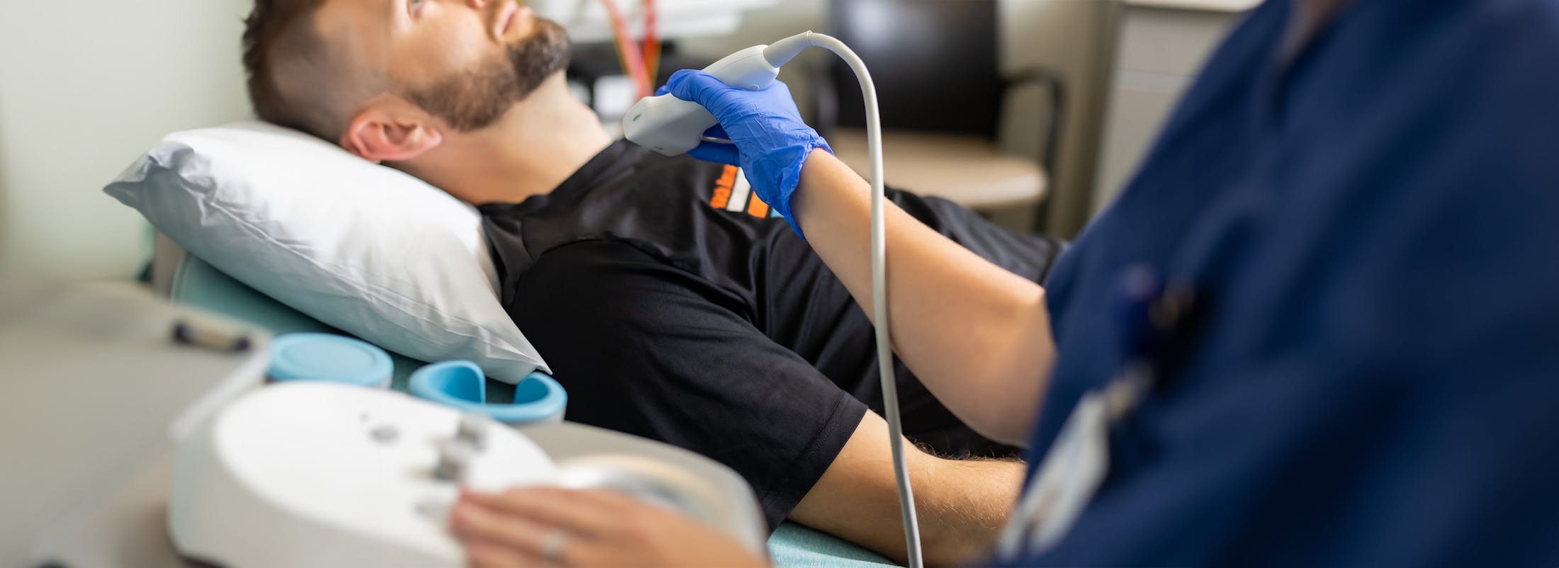 doctor using ultrasound on patient