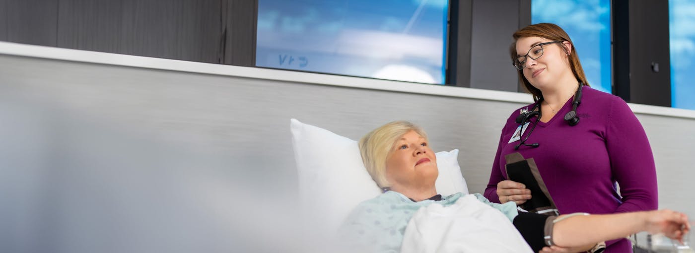 woman having her blood pressure taken