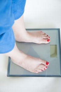 Woman checking her weight
