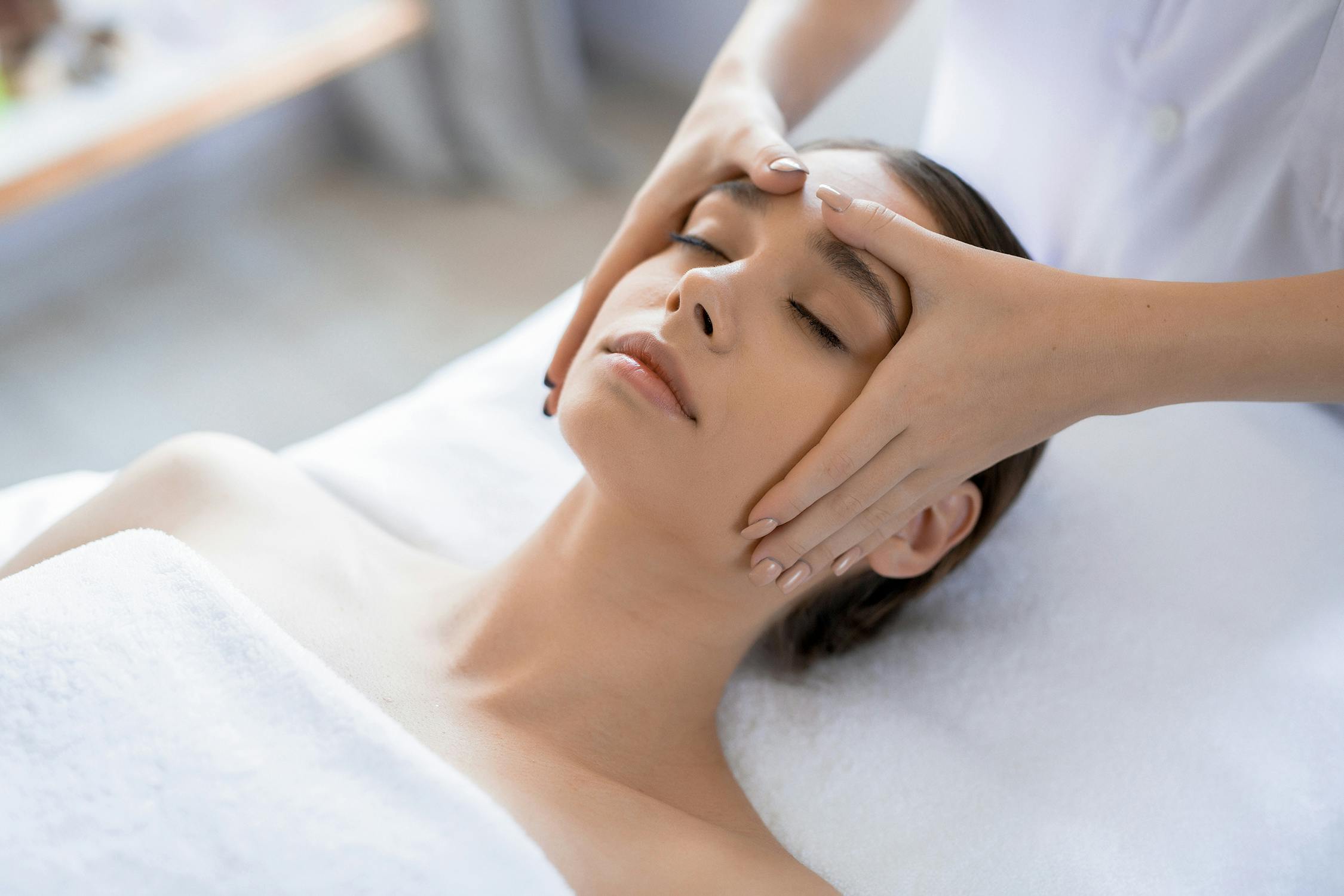 Woman receiving a facial