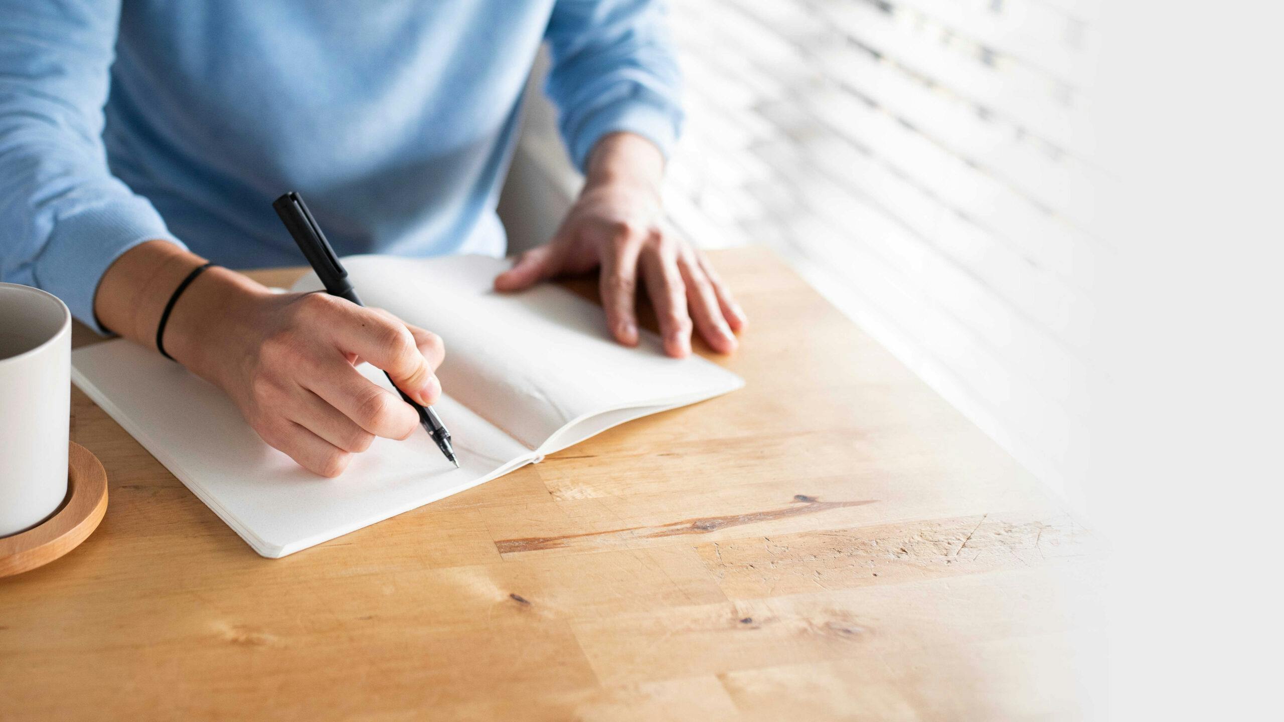 Person Writing on paper