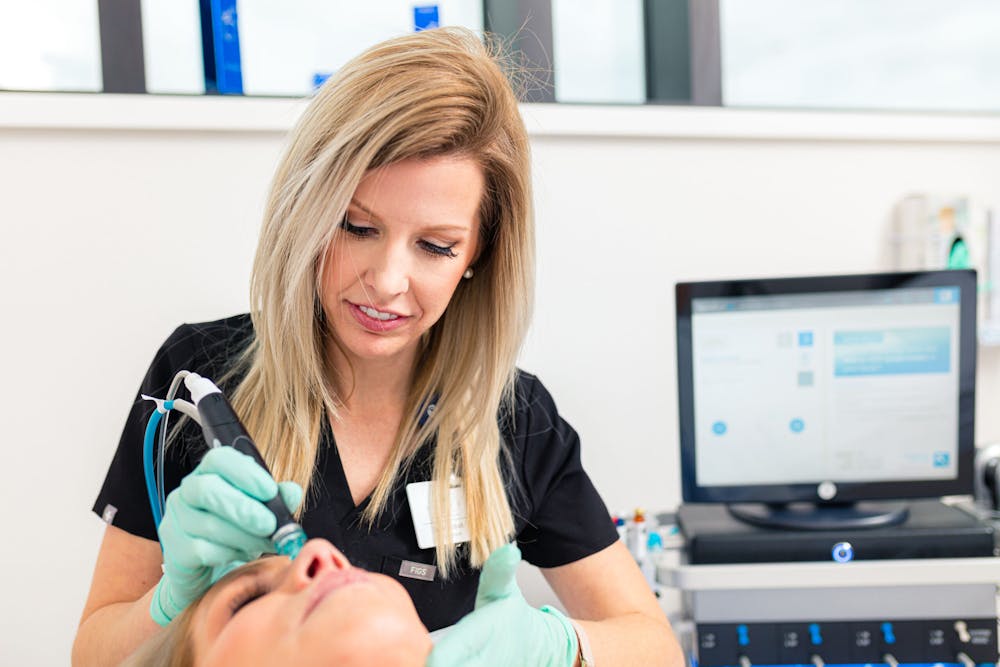 Woman receiving dermaplaning