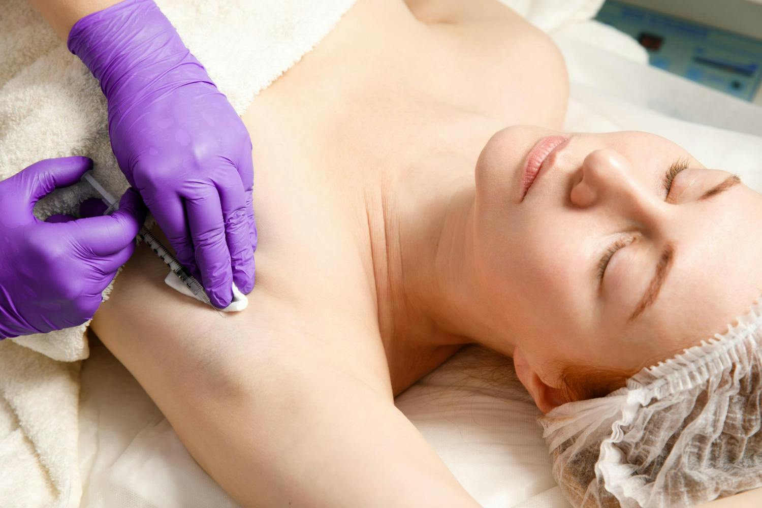 Woman receiving botox in armpit