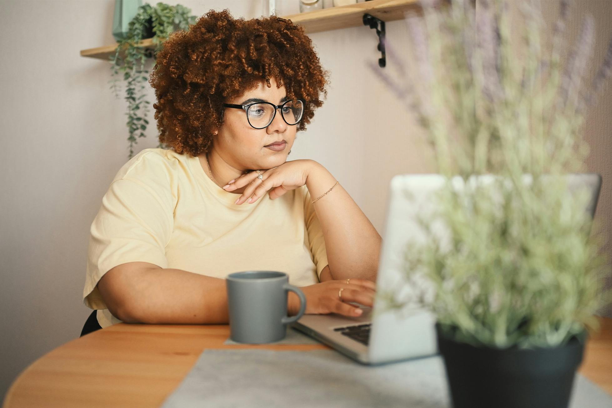 smiling woman next to window