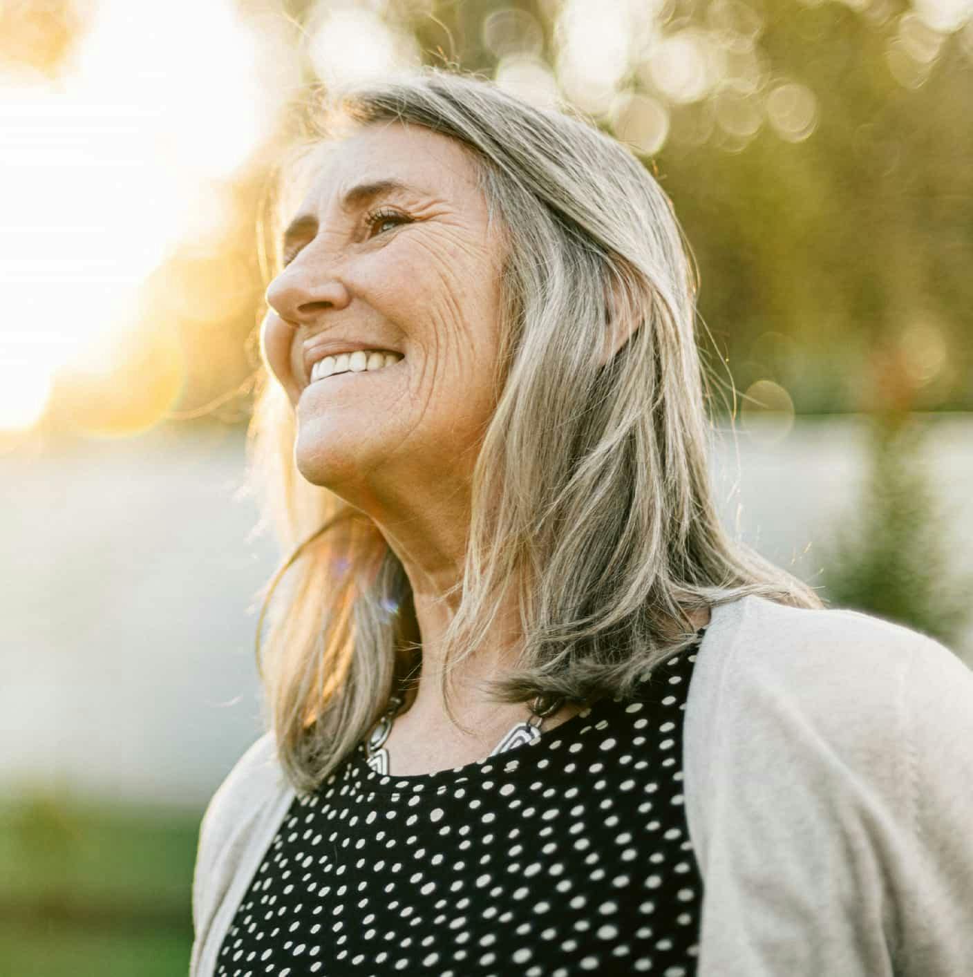 Woman outdoors smiling