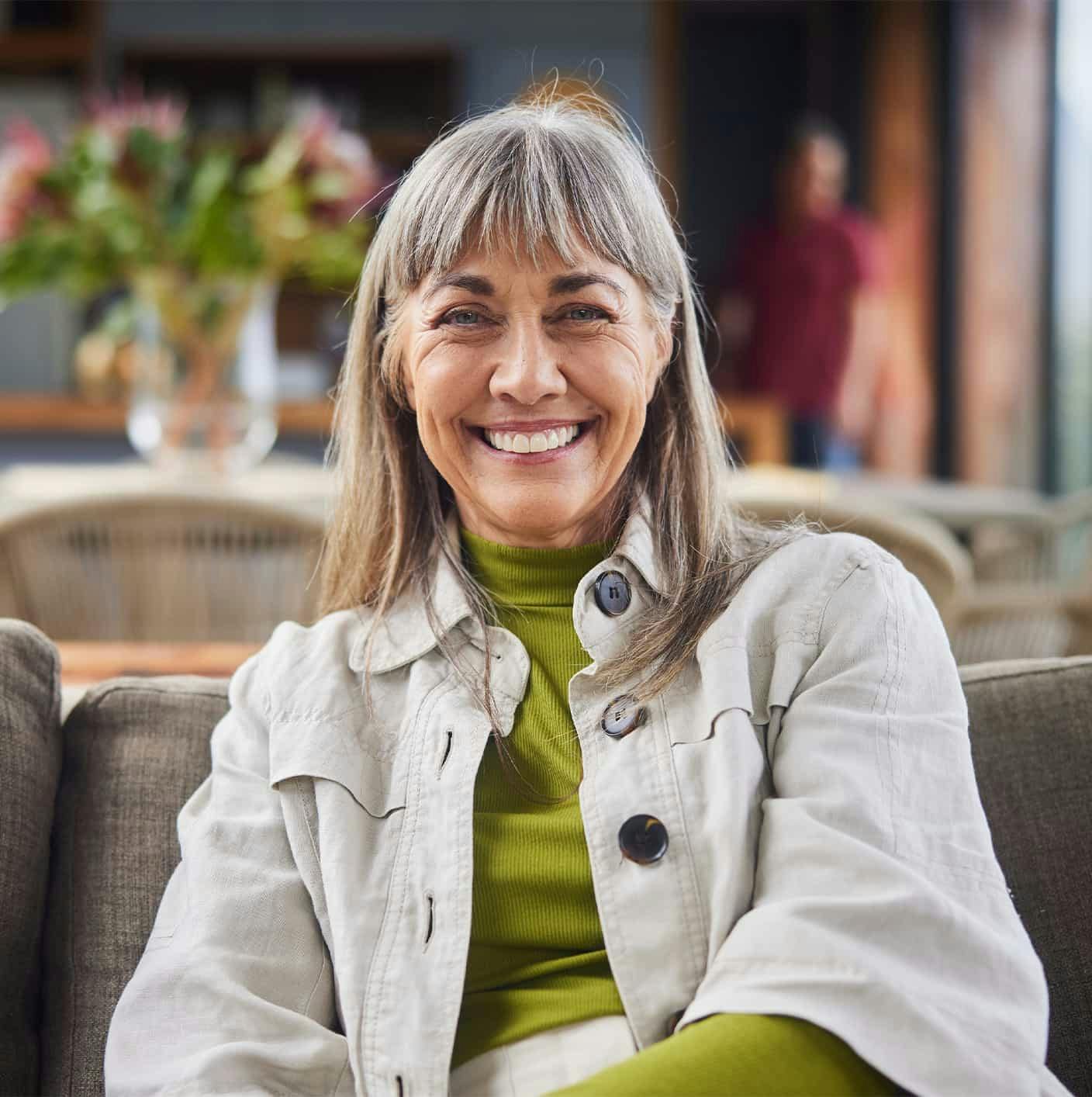 Woman smiling on couch
