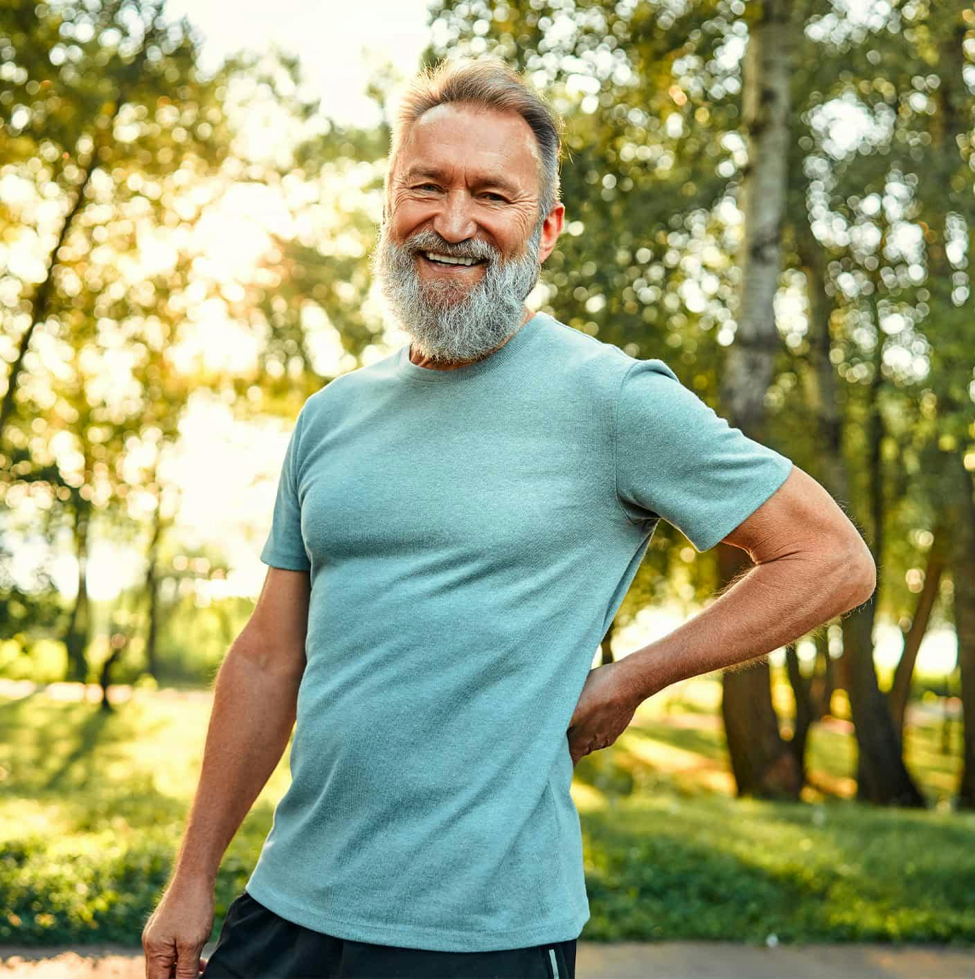 Older man smiling outdoors